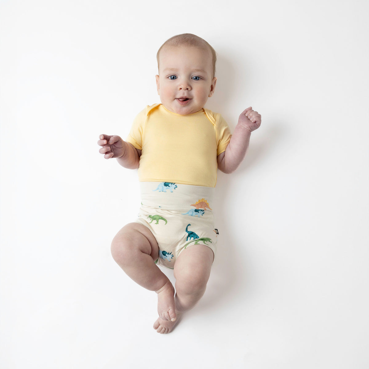 Baby modeling ecru roar bummies and lilikoi bodysuit