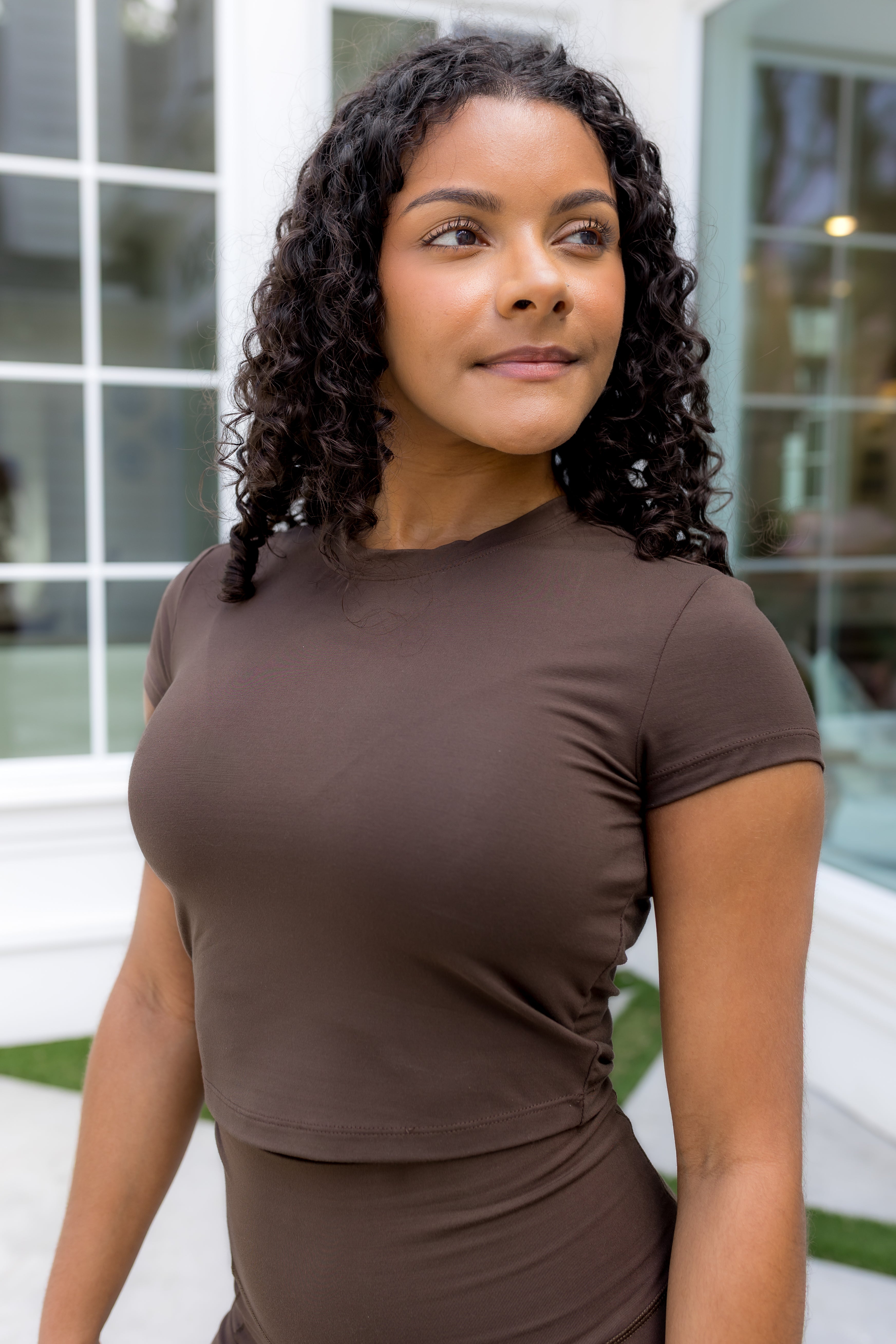 Model wearing the Bamboo Flex Baby Tee in Espresso