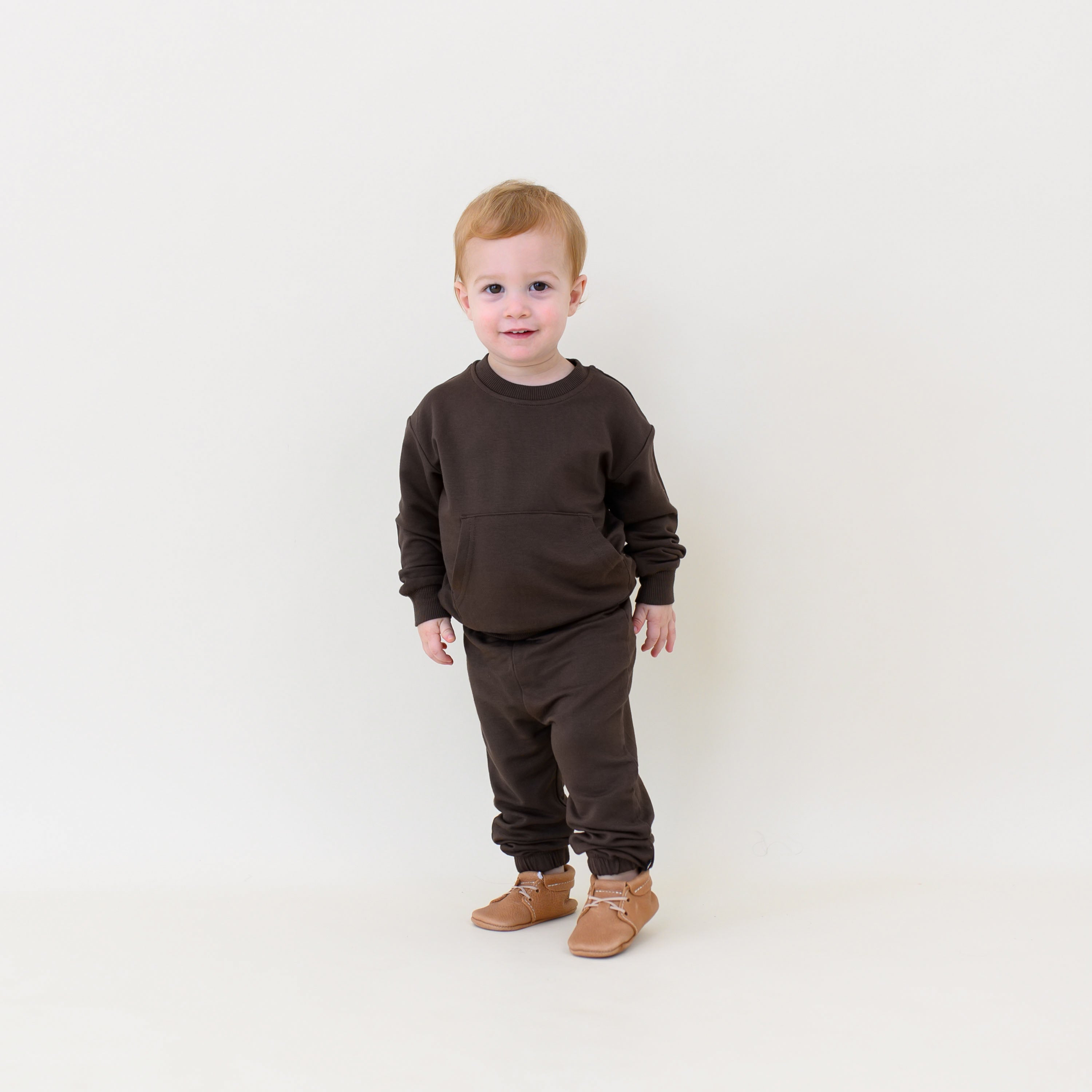 Young toddler walking wearing the French Terry Jogger Set in Espresso