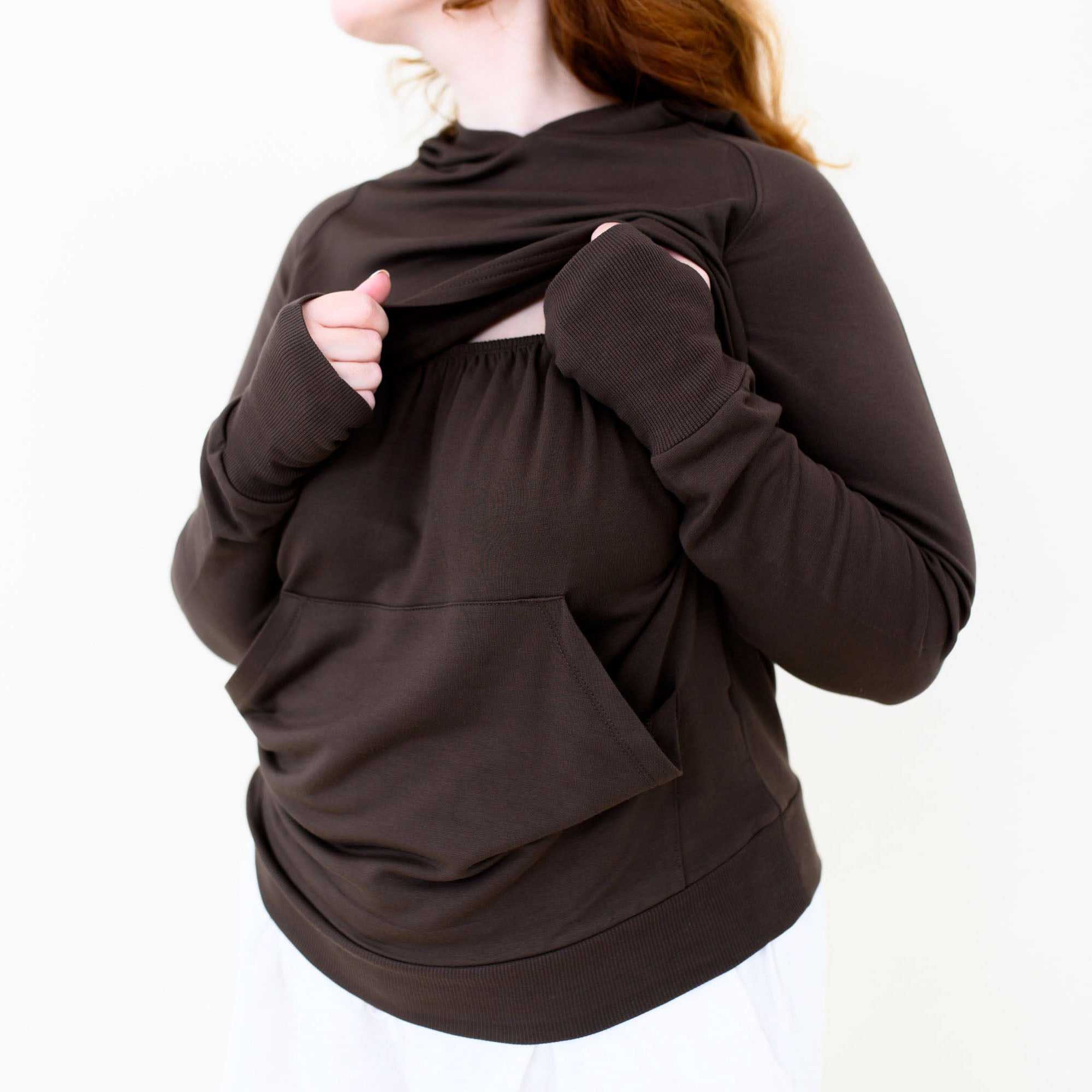 The front fabric of the Women's French Terry Nursing Hoodie in Espresso pulled up showing the elastic band front for easy pulldown for nursing