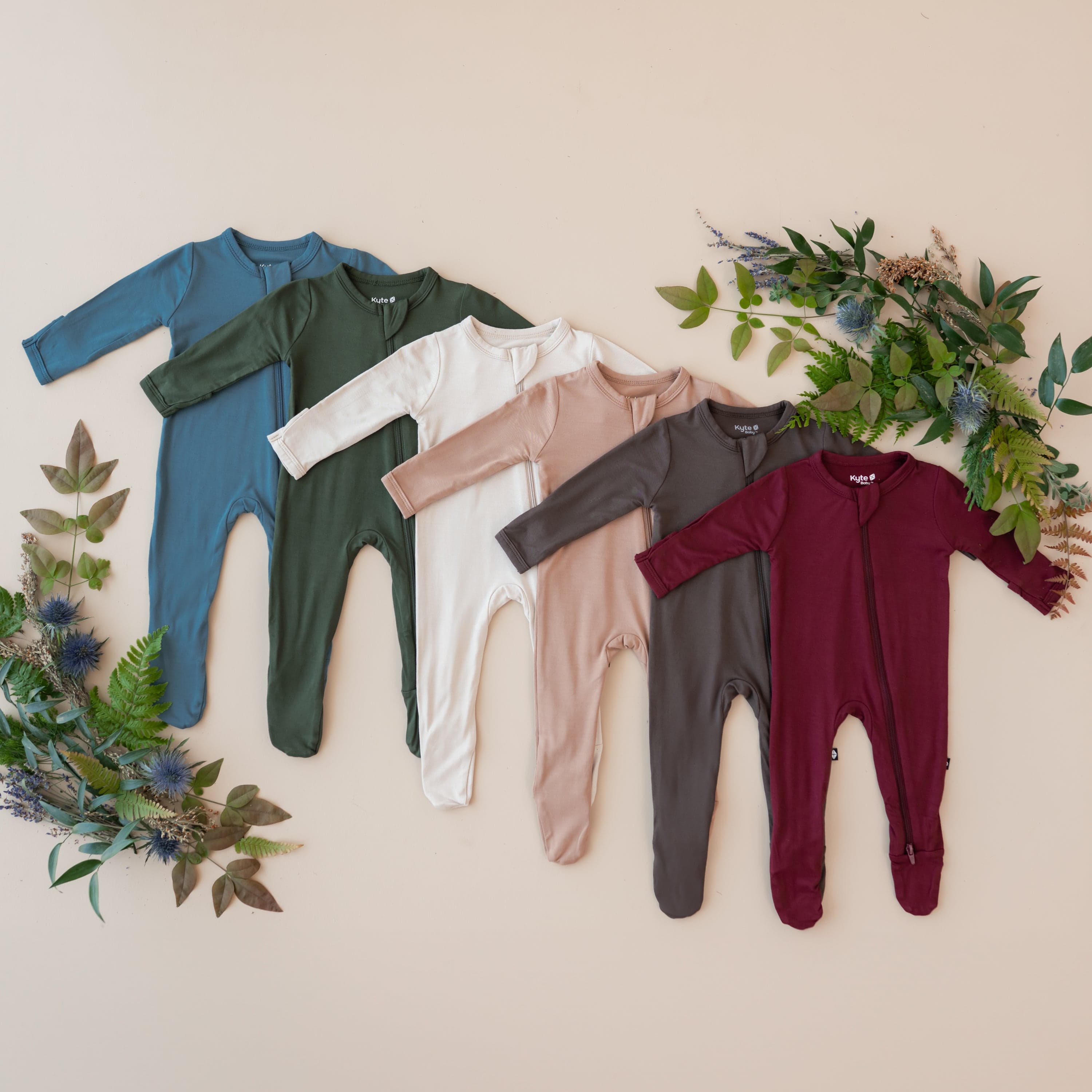 Flat lay of Zippered Footies in Fall colors