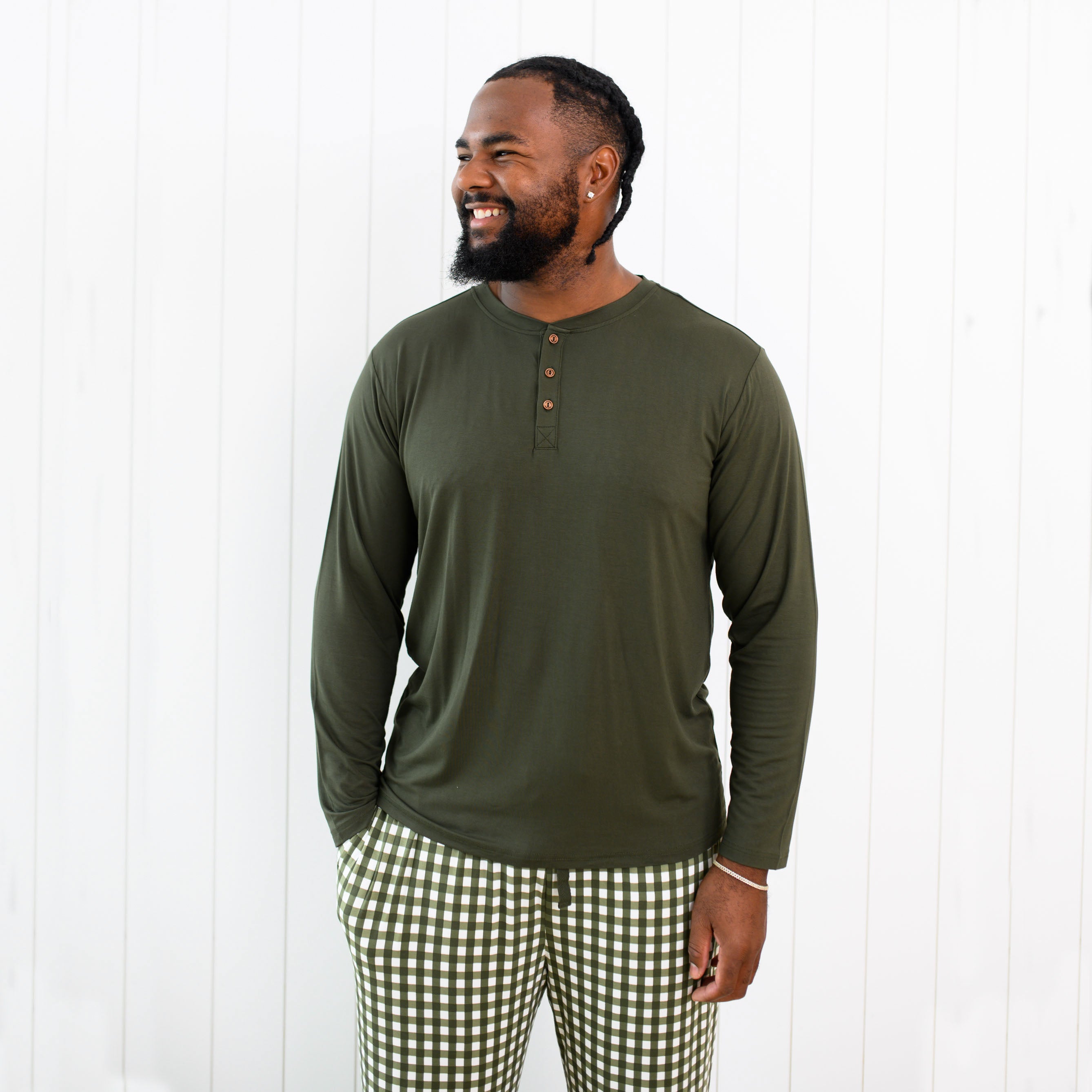 Close up of the Men's Lounge Pants in Gingham Fir on a model paired with the Men's Henley Top in Fir