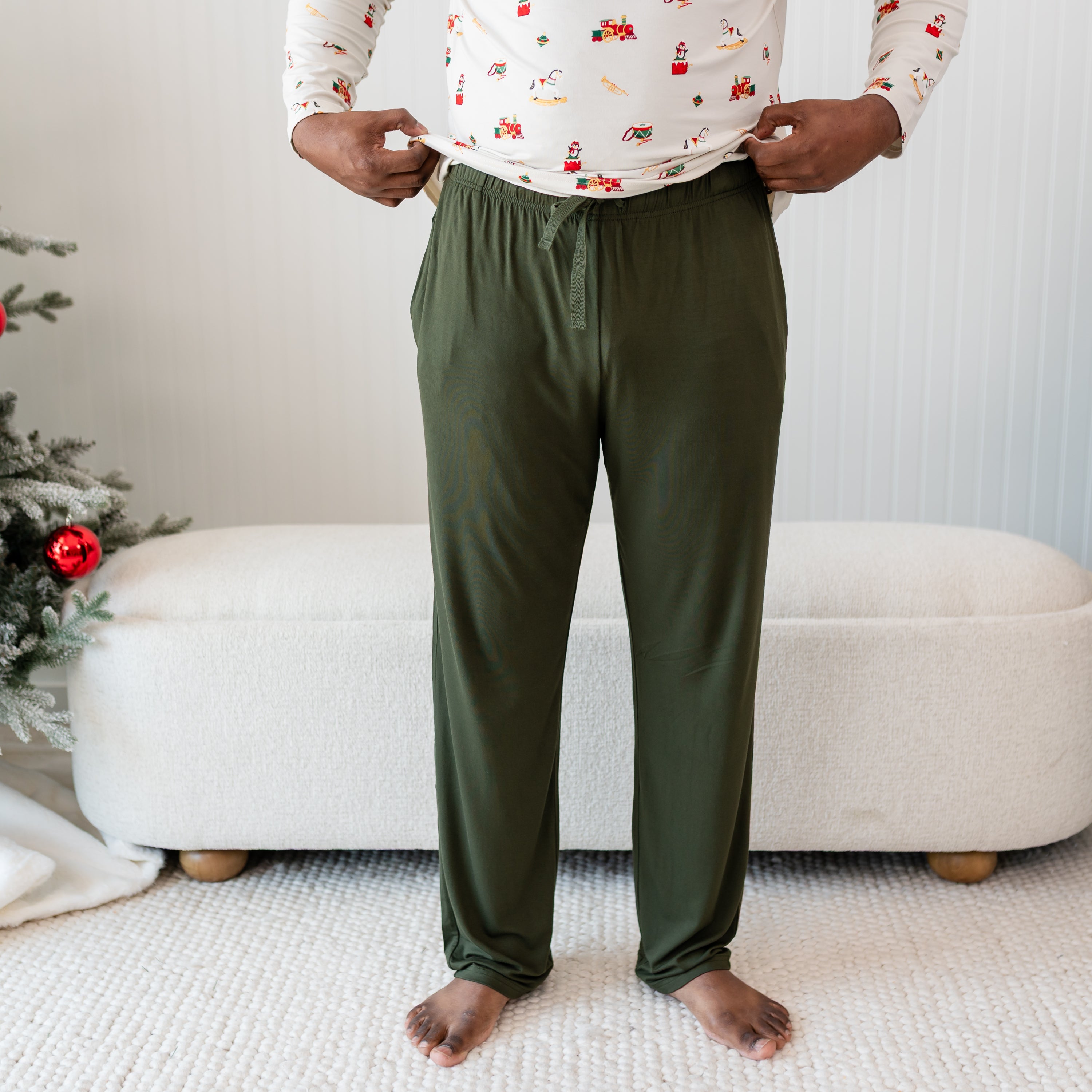 Men's lounge pant in fir on a model paired with a Vintage Toys shirt