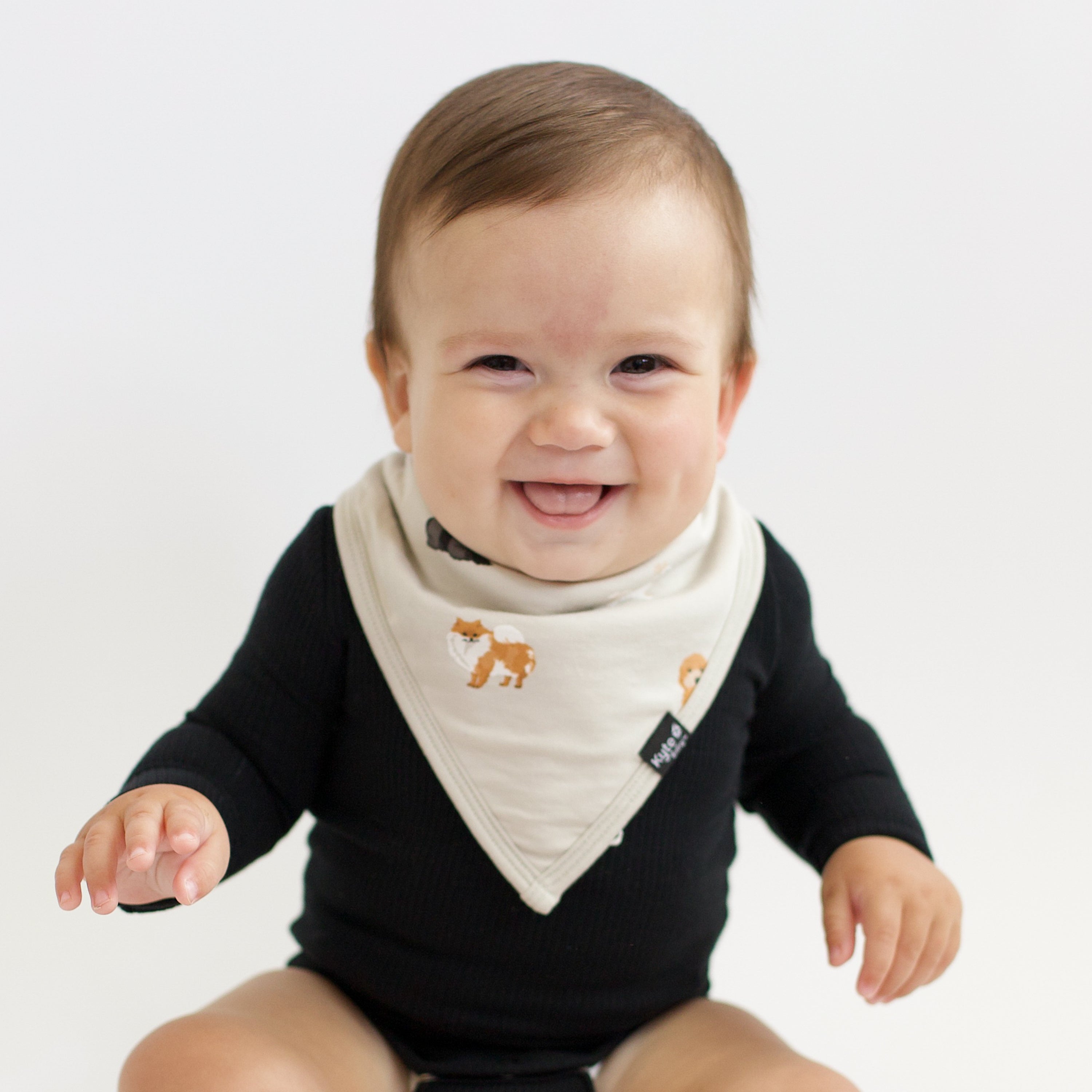 Baby wearing Bib in Fluffy Dog and Midnight Long Sleeve Bodysuit