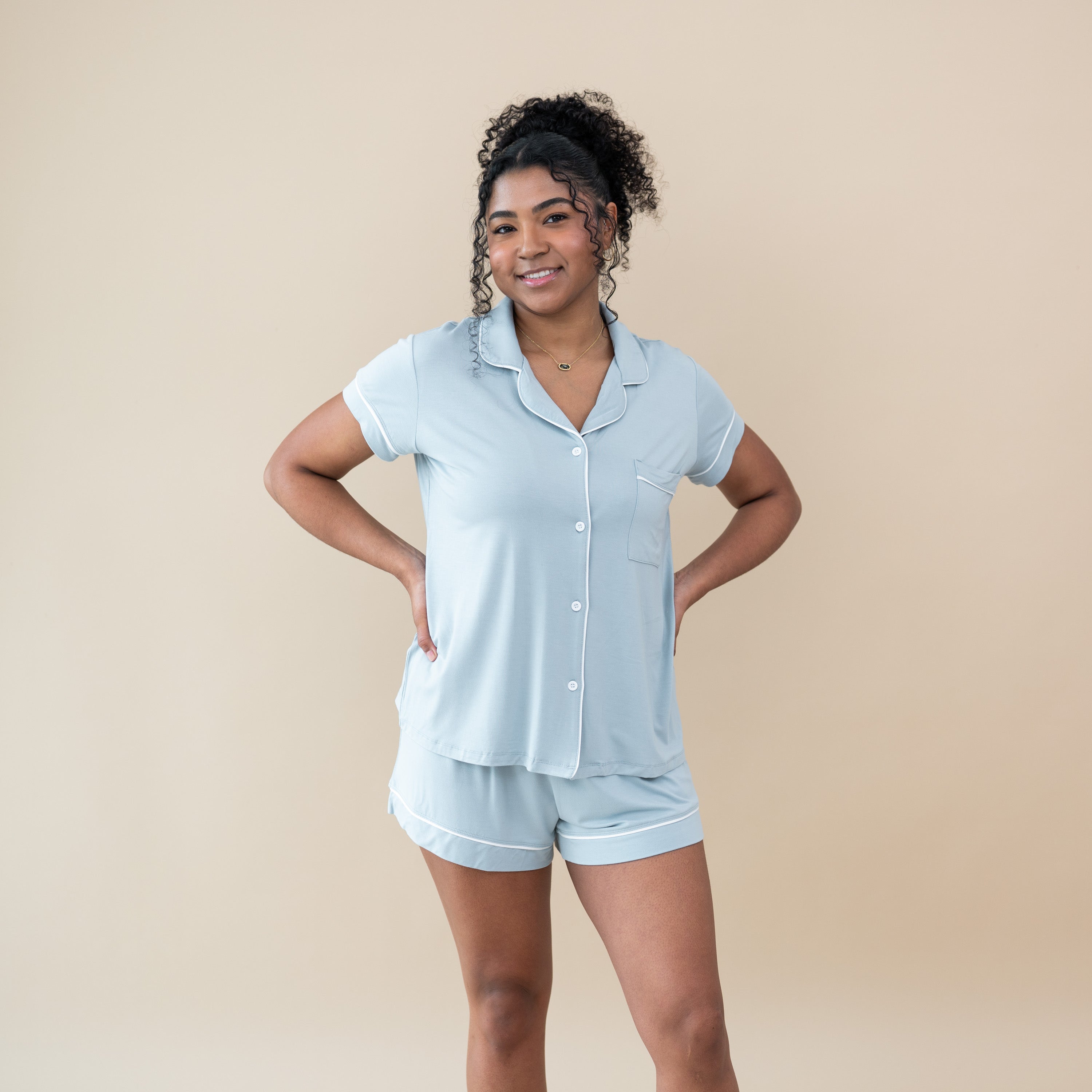 Woman wearing Women’s Short Sleeve Button-up Pajama Set in Fog Blue with Cloud White Trim