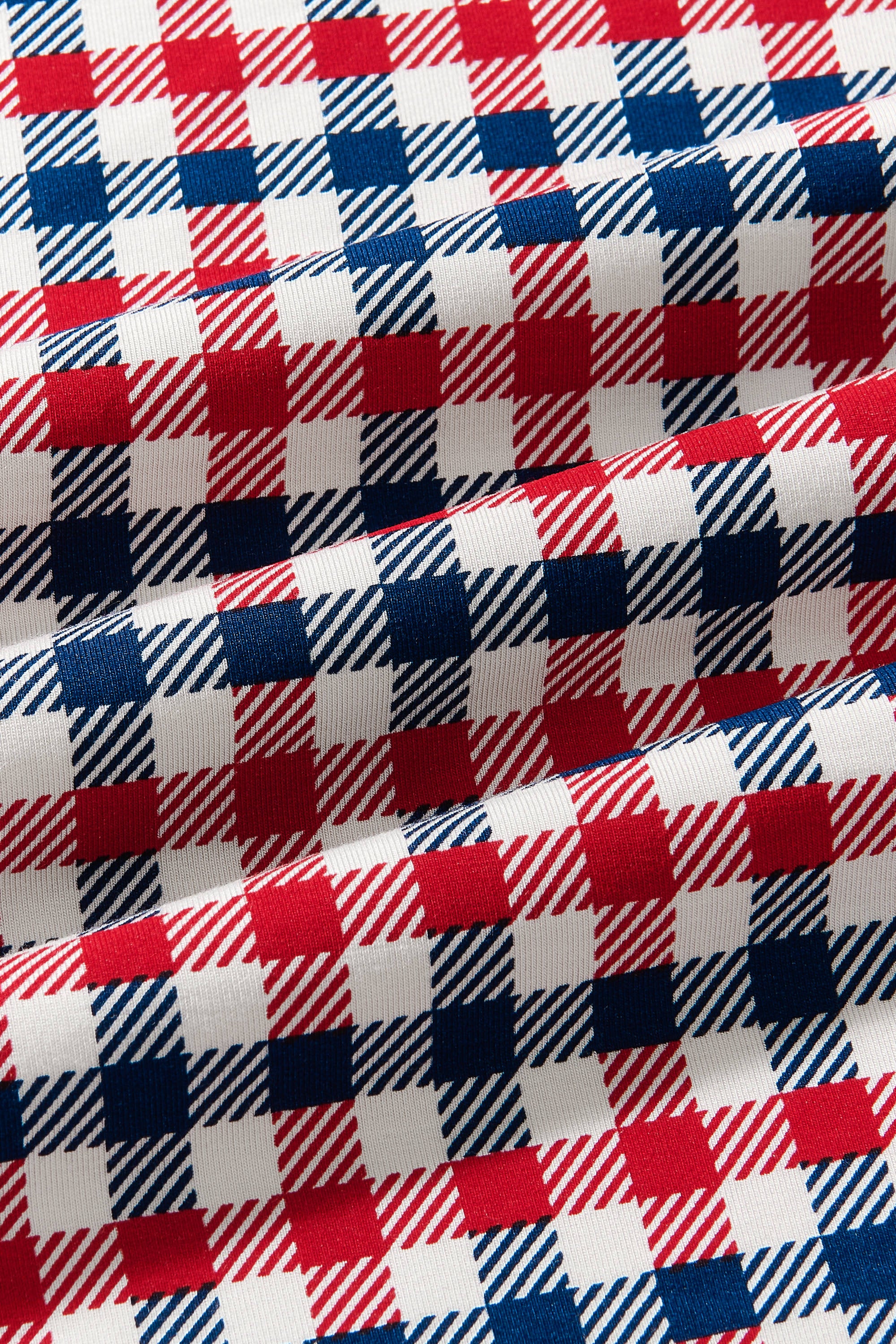 Close up of fabric with blue red and white Patriotic Gingham check print
