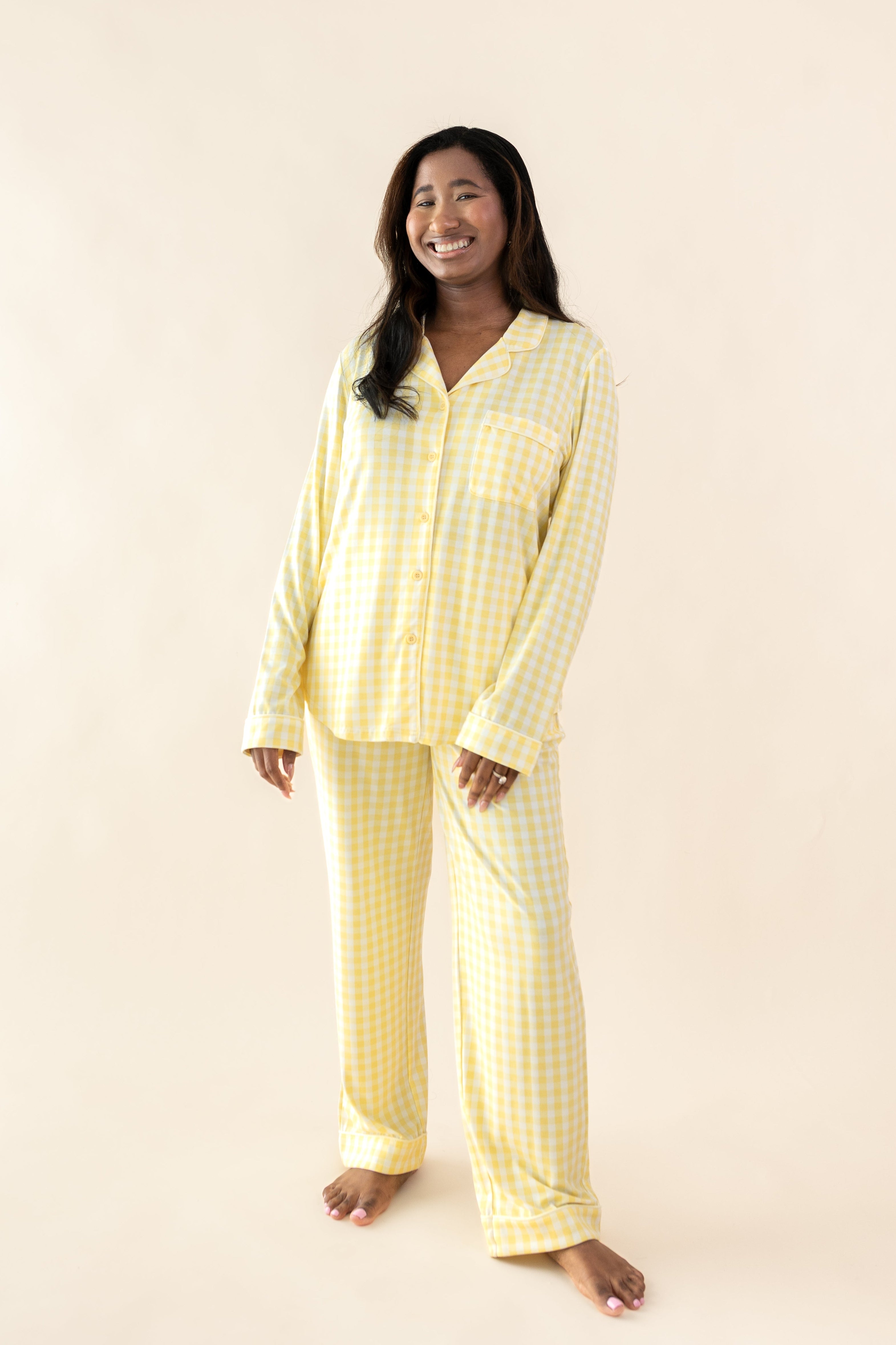 Smiling female posing wearing the Long-Sleeved Women's Pajama Set in Gingham Chamomile