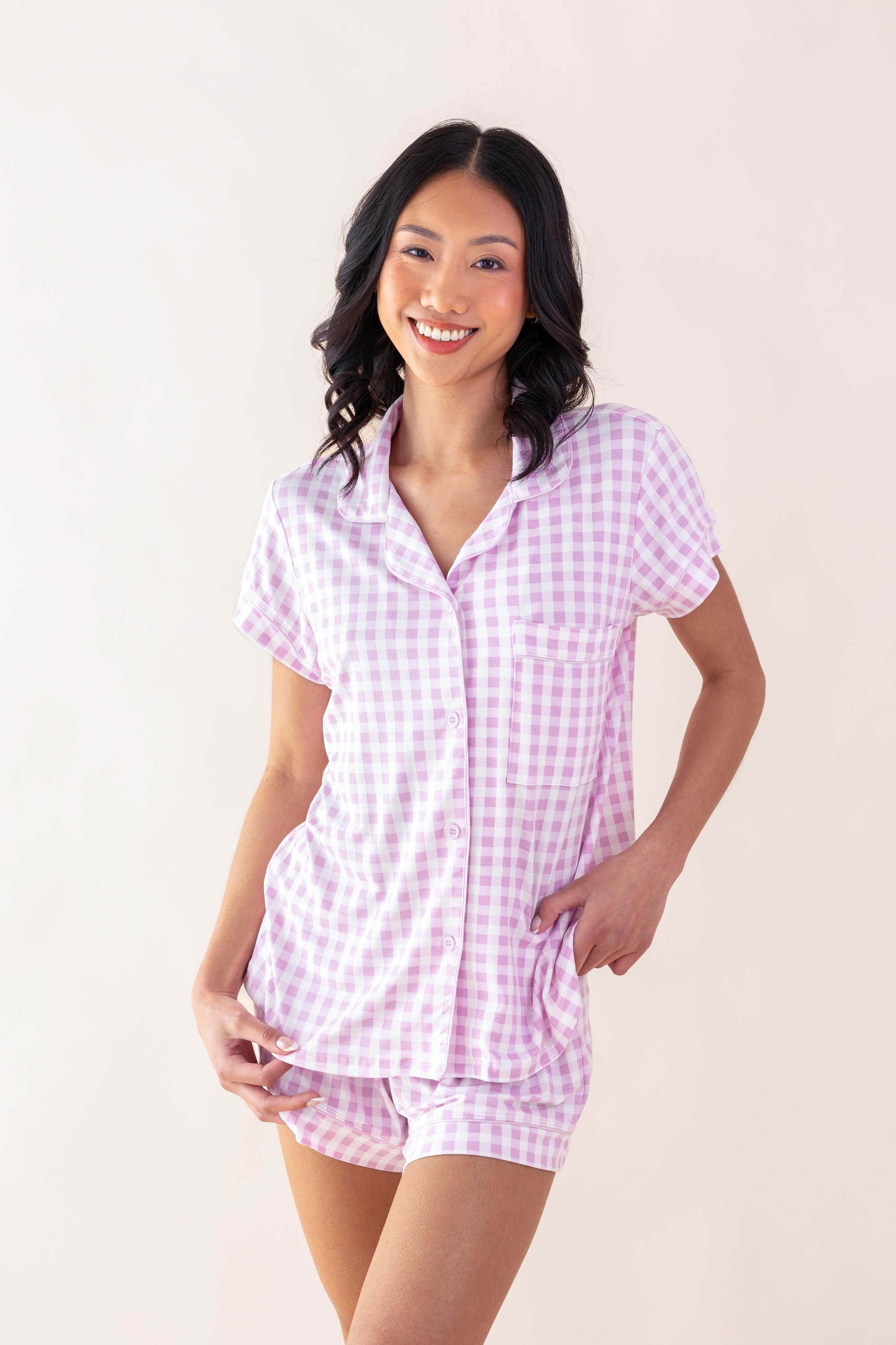 Smiling female model posing wearing the Women's Short Sleeve Pajama Set in Gingham Thistle