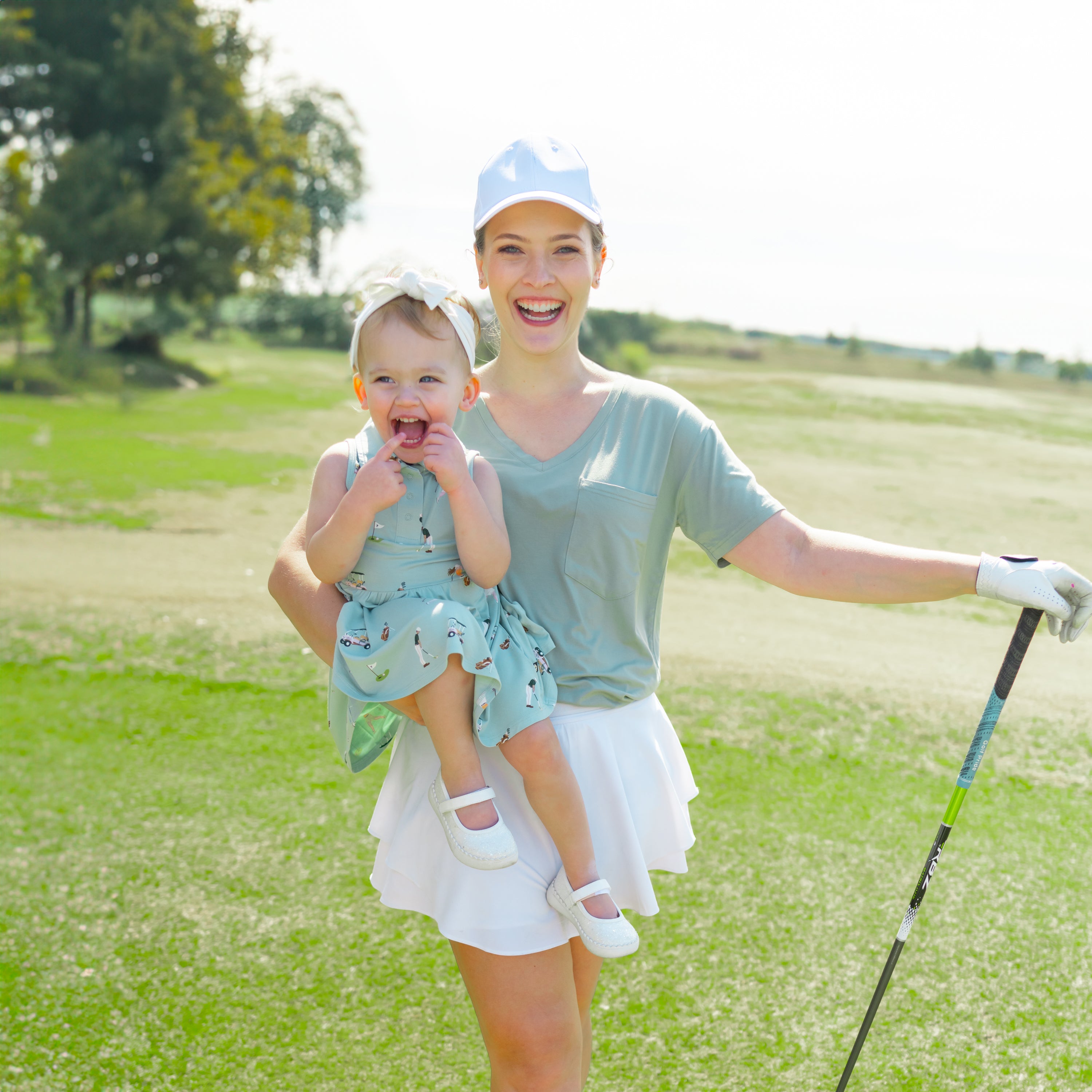 Mom holding Toddler in Polo Bodysuit Dress in Golf print