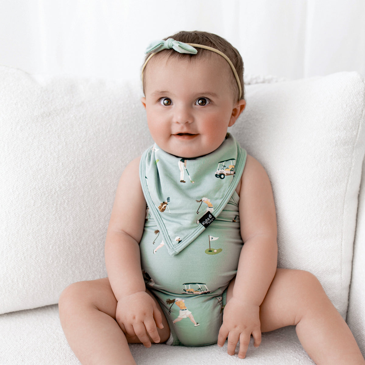 Infant wearing Bib in Golf over Spaghetti Strap Bodysuit