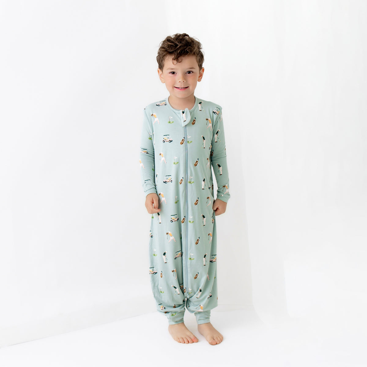 Toddler wearing Sleep Bag Walker in Golf 0.5 and matching pajamas