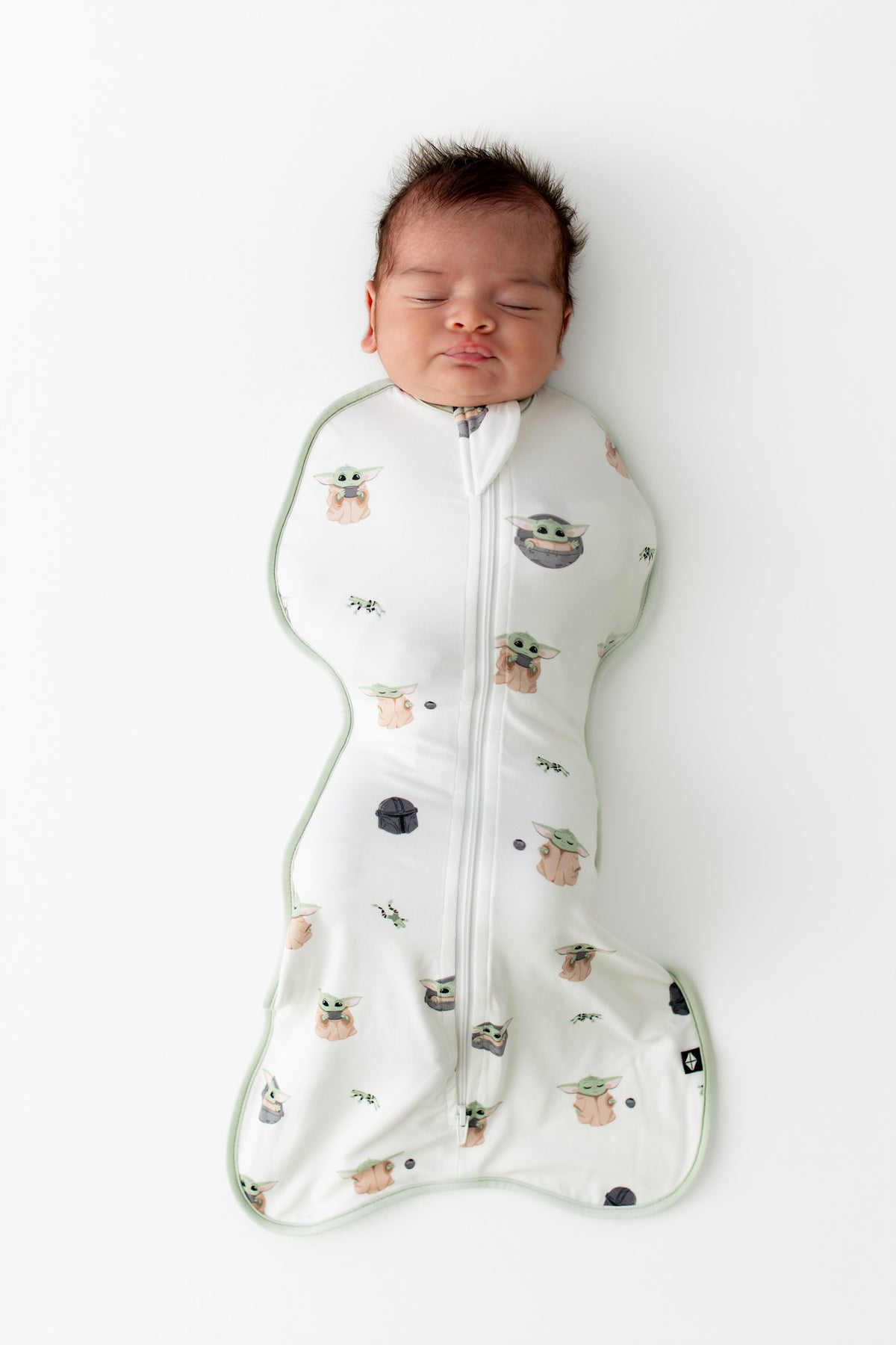 Sleeping infant wearing the Swaddle Bag in Grogu™ 0.5