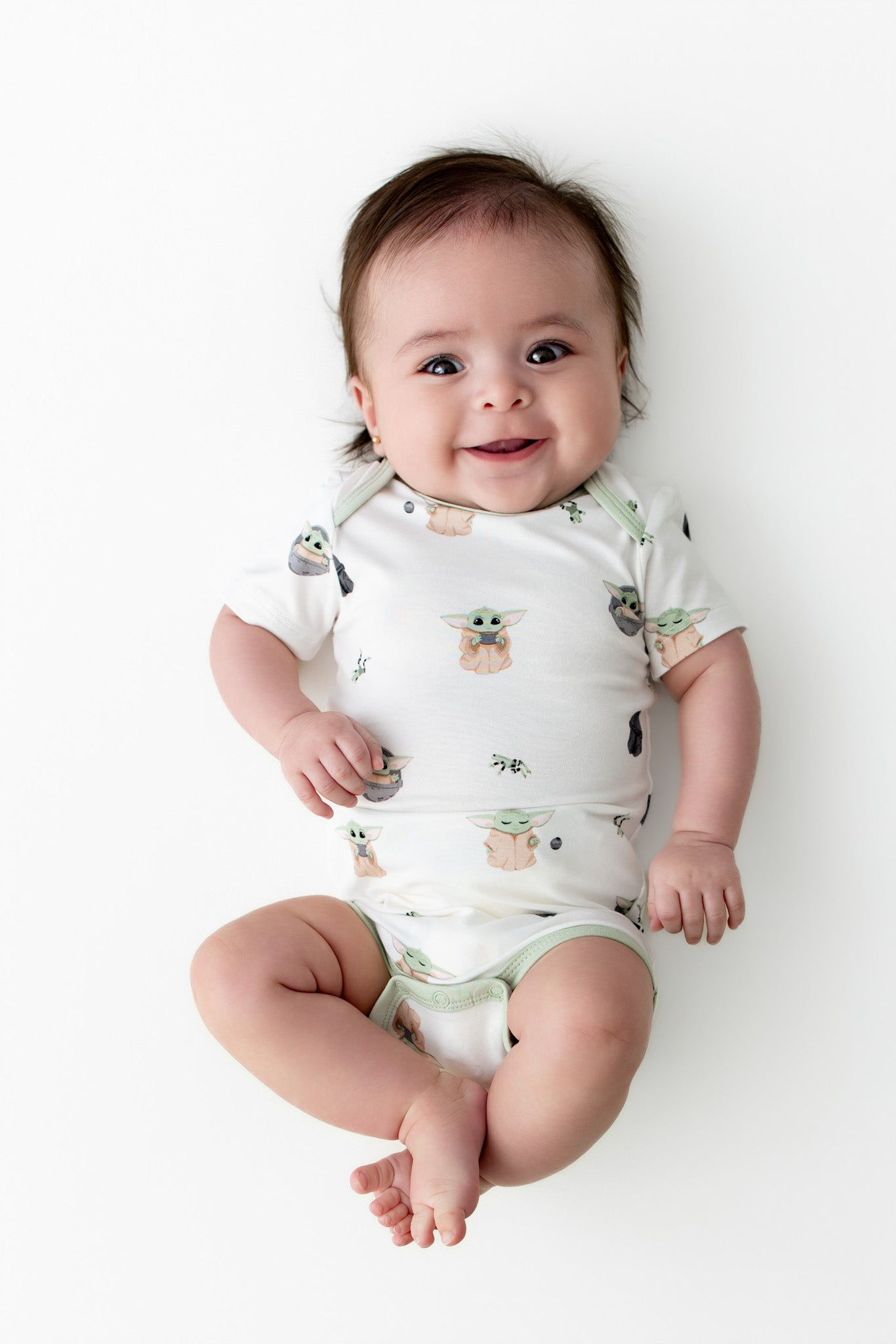 Smiling infant wearing the Bodysuit in Grogu™