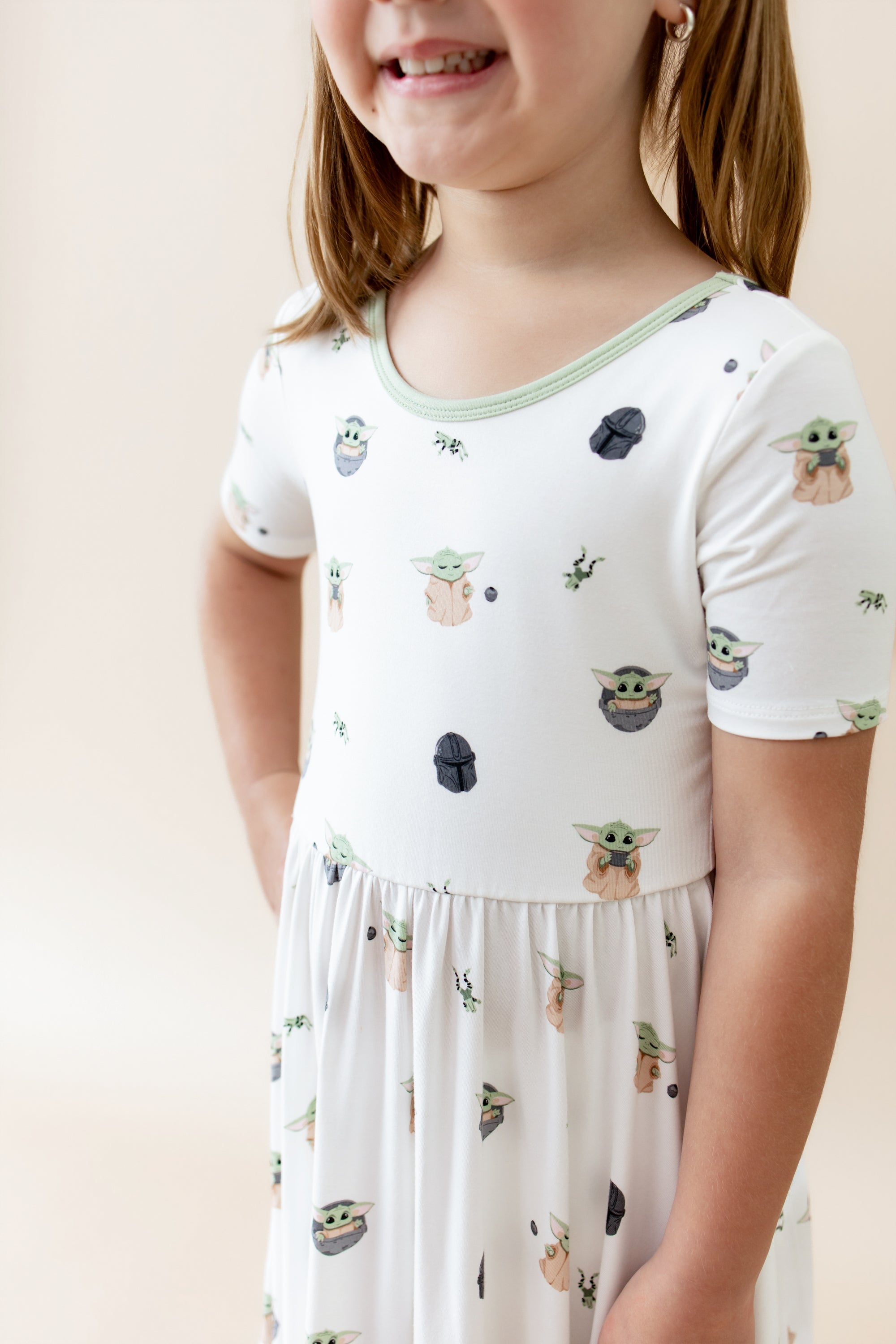 Close up of the Twirl Dress in Grogu™ shown on a young girl