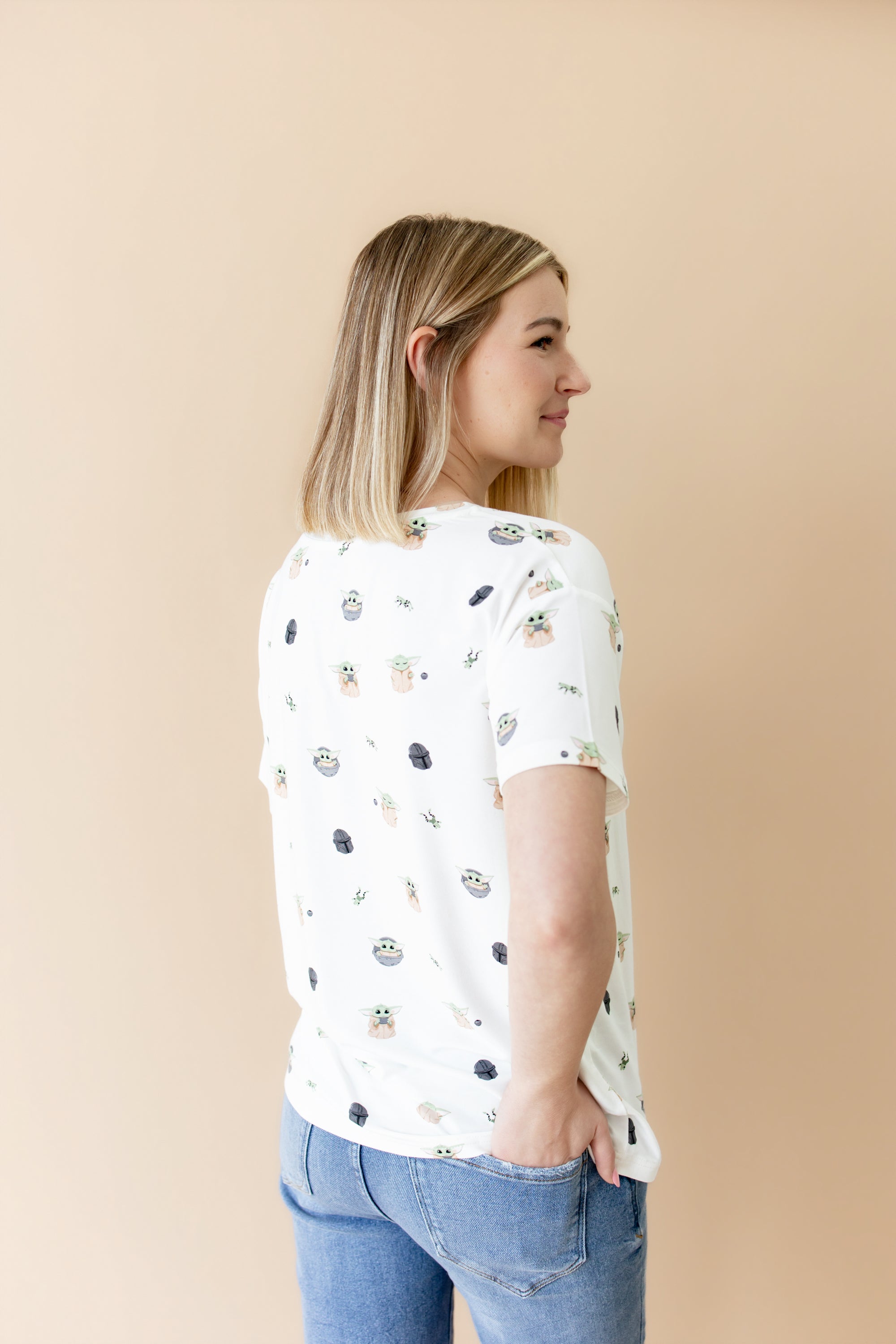 The back of the Women's Relaxed Fit V-Neck in Grogu™ on a female model