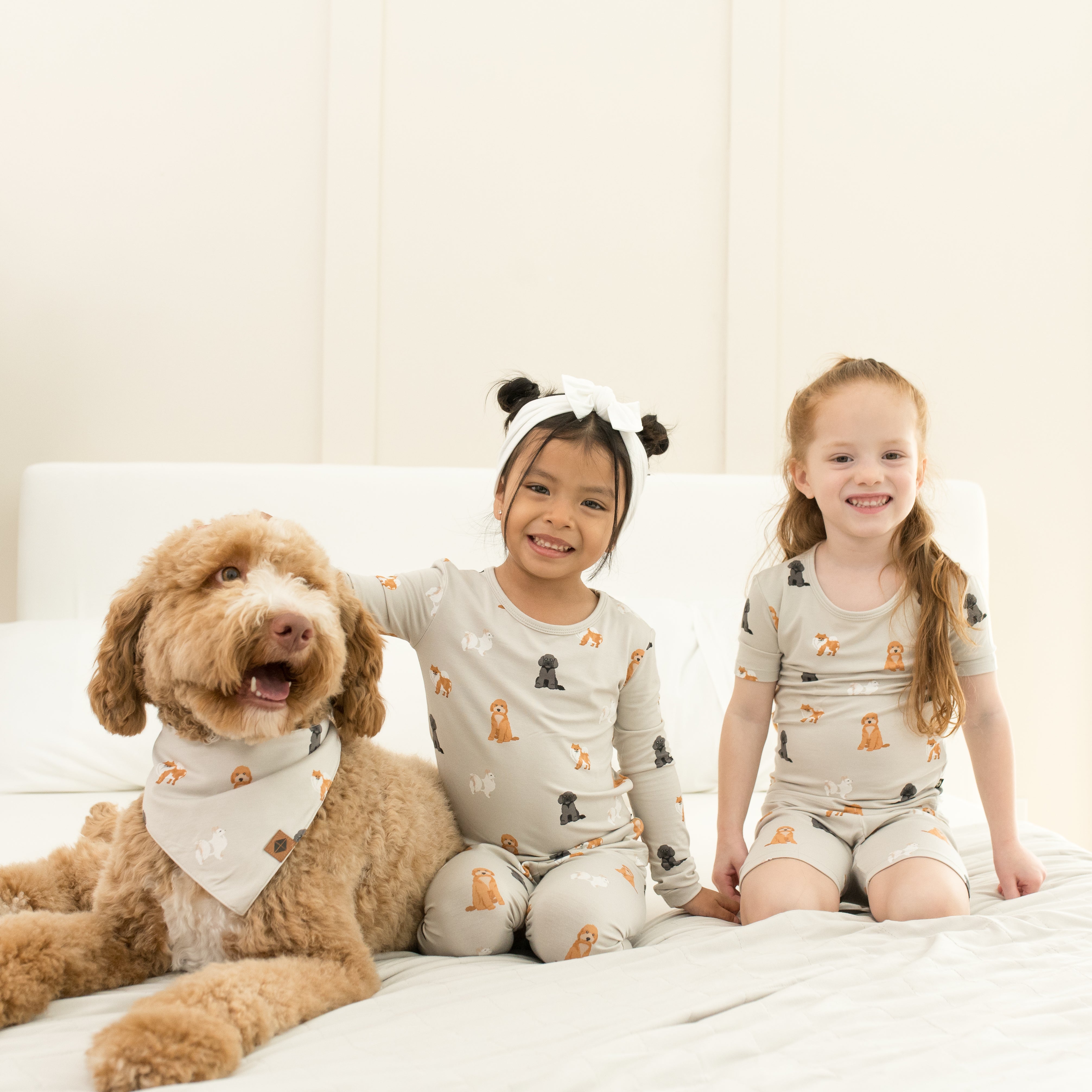 Two young girls and a dog all matching in Fluffy Dog
