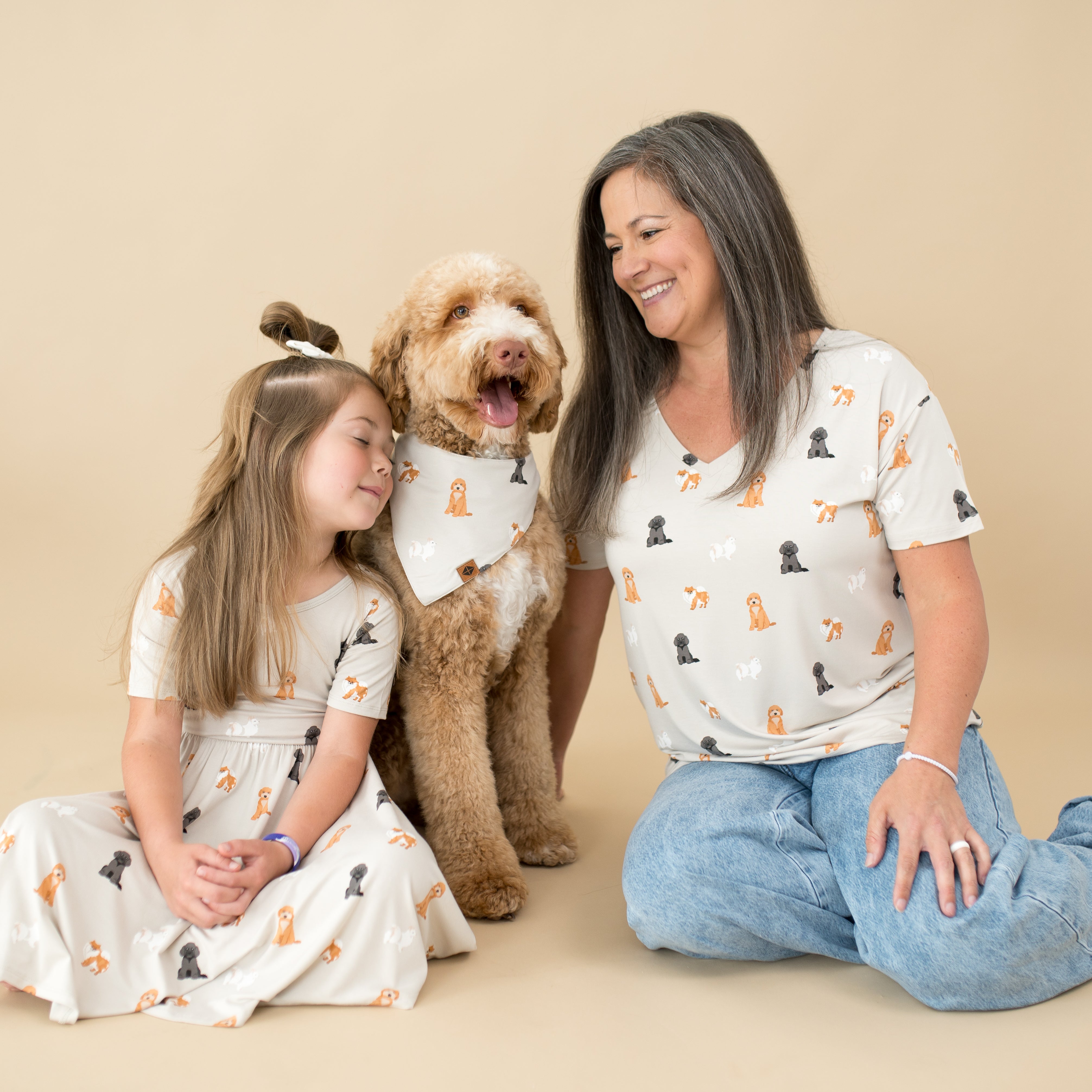 Woman, child and dog modeling Kyte Baby Fluffy Dog collection
