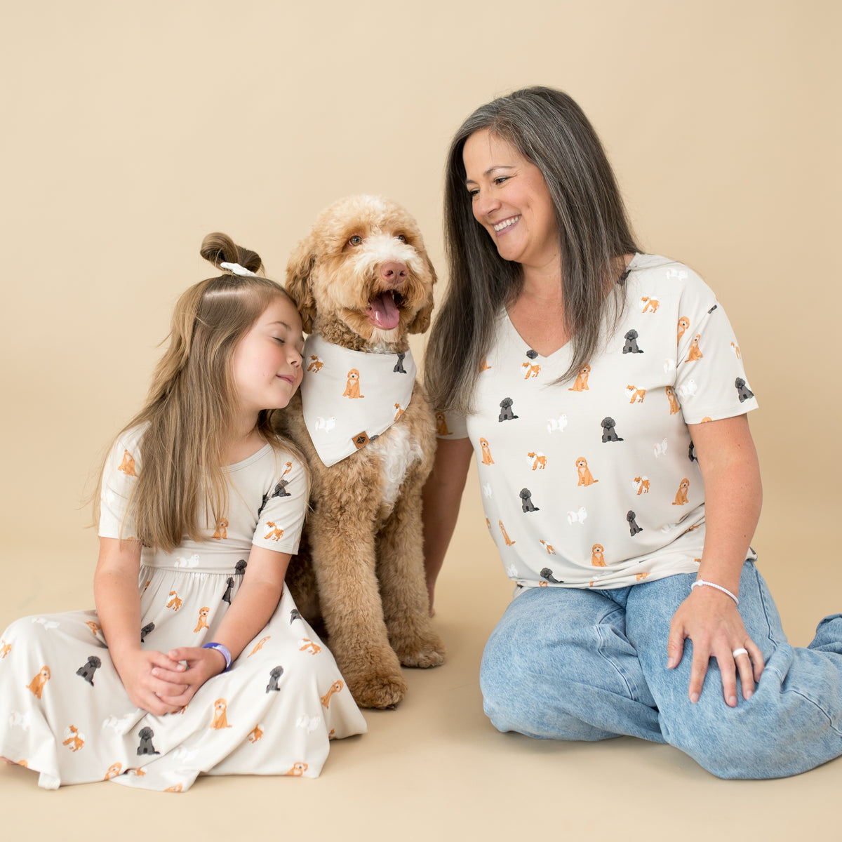 Woman, child and dog modeling Kyte Baby Fluffy Dog collection