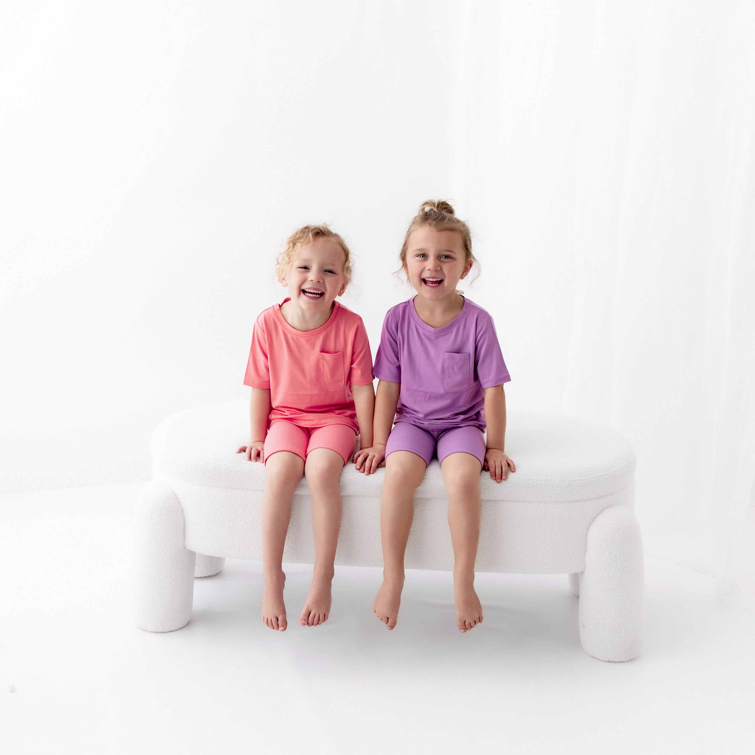 Kids wearing Toddler Crew Neck Tees in Guava and Poi with matching ribbed shorts