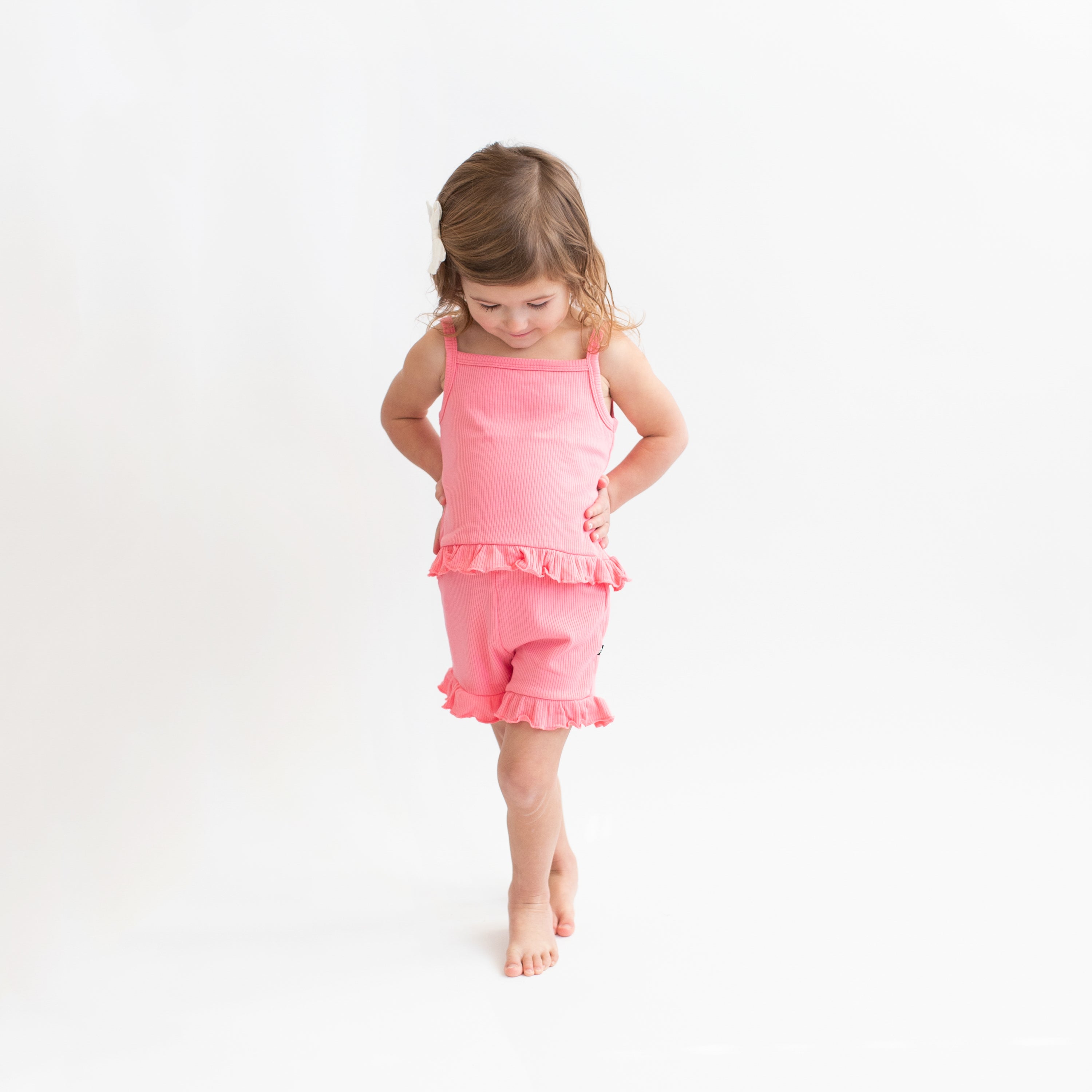 Girl wearing Ribbed Ruffle Tank Set in Guava pink