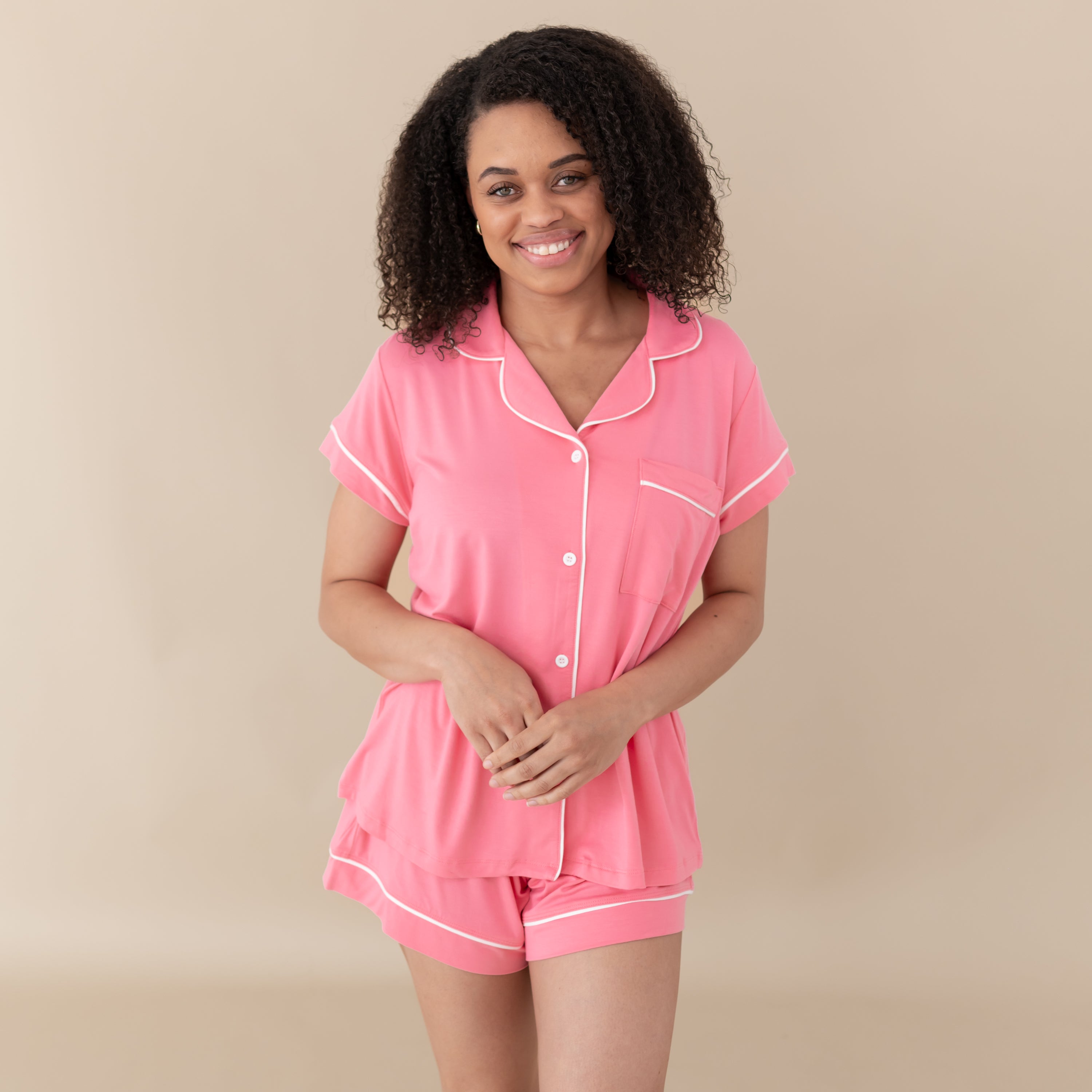 Woman modeling Women’s Short Sleeve Pajama Set in Guava with Cloud Trim
