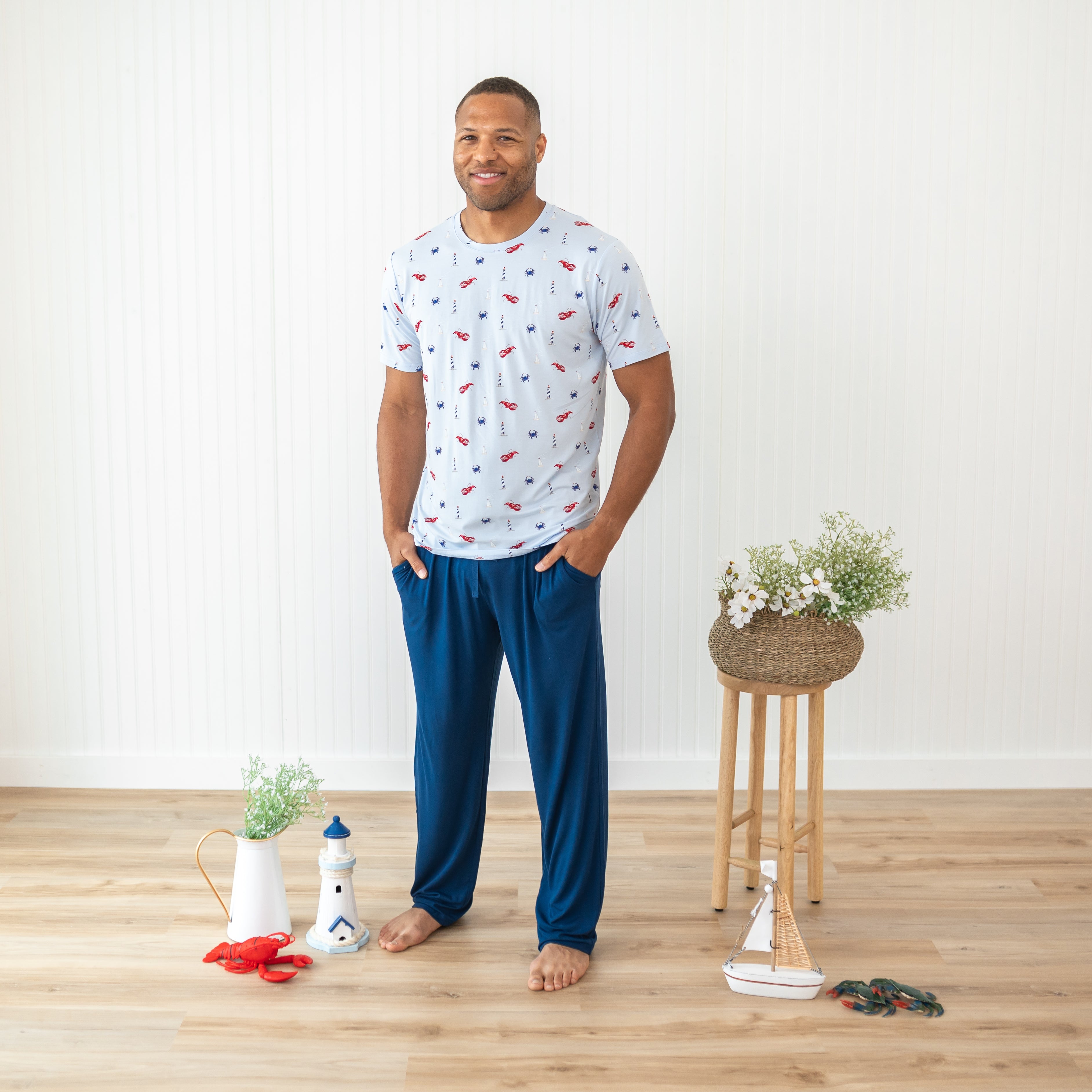 Smiling male model wearing the Men's Crew Neck Tee in Harbor paired with Men's Lounge Pant in Tahoe