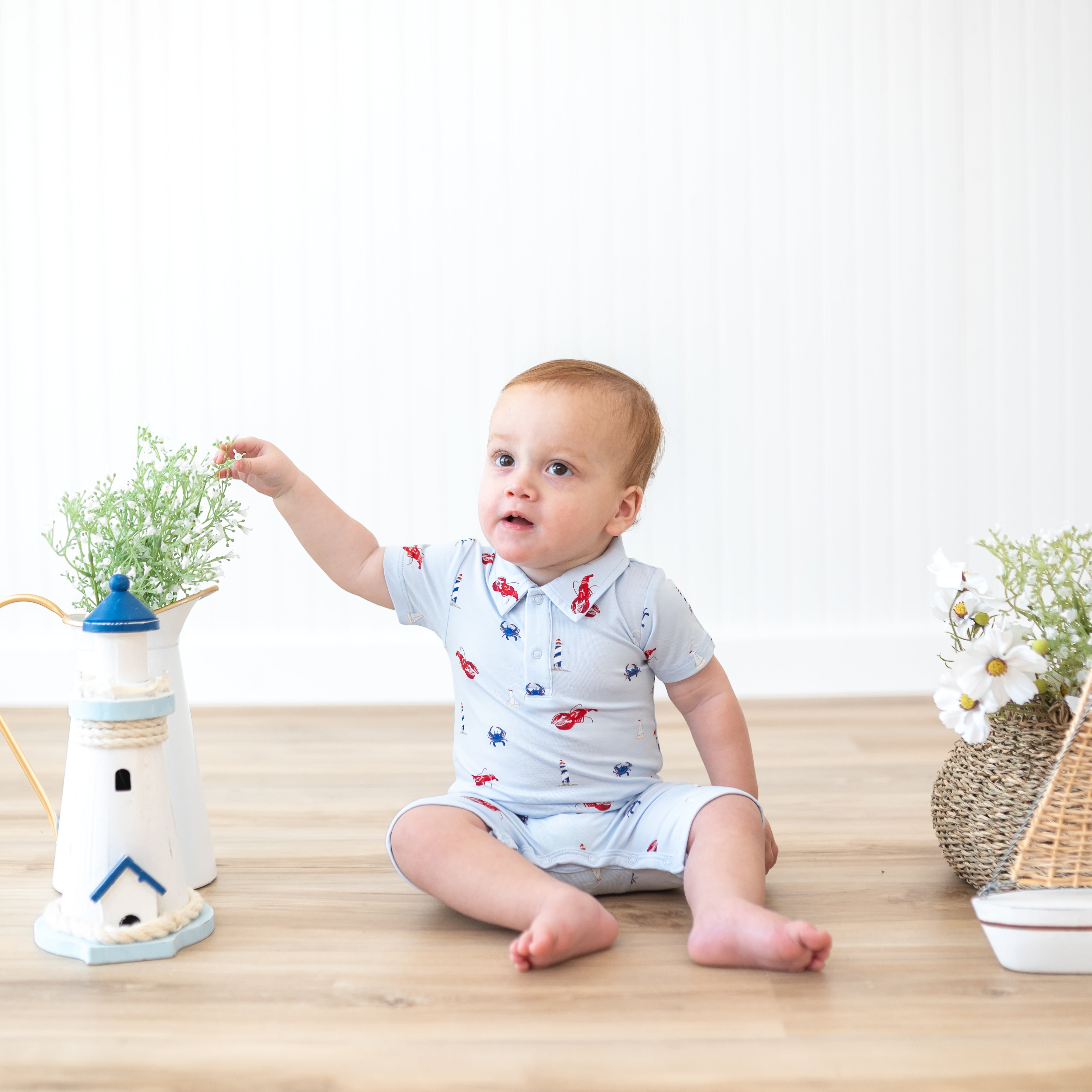Infant wearing Polo Short-all in Harbor coastal print