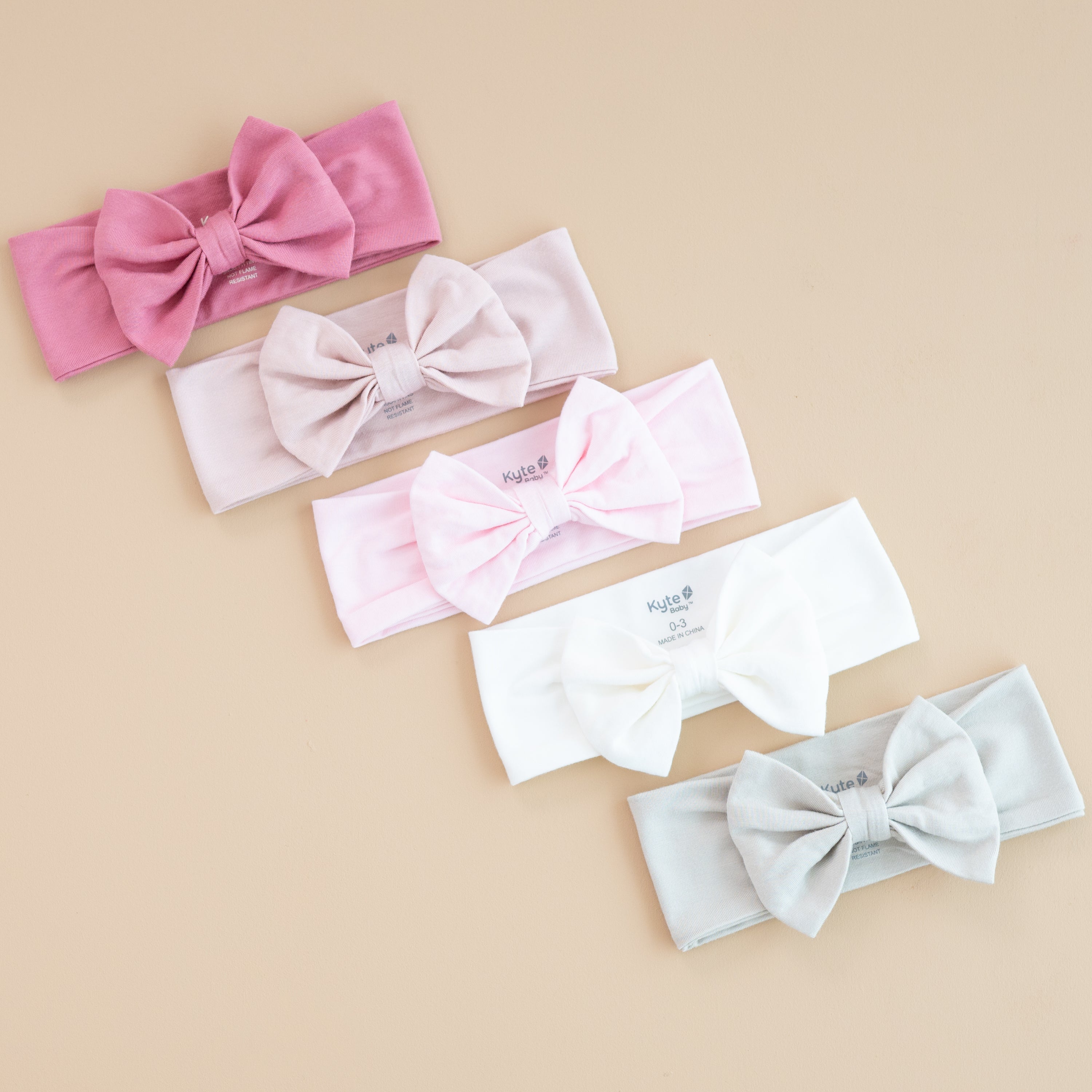 Girls Bow Headbands in core colors apple blossom, blush, sakura, cloud, and oat