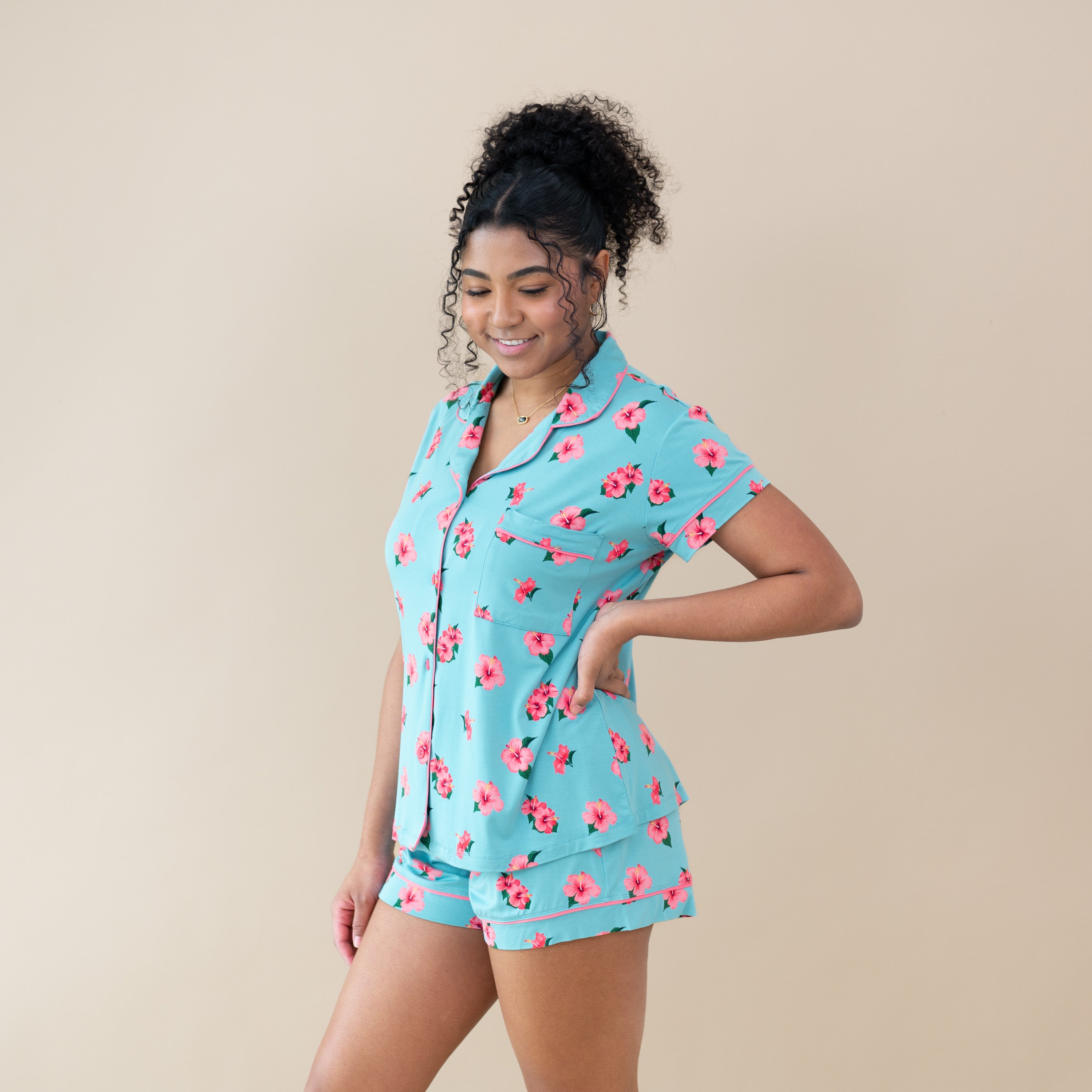 Woman modeling Women’s Short Sleeve Pajama Set in Hibiscus to the side