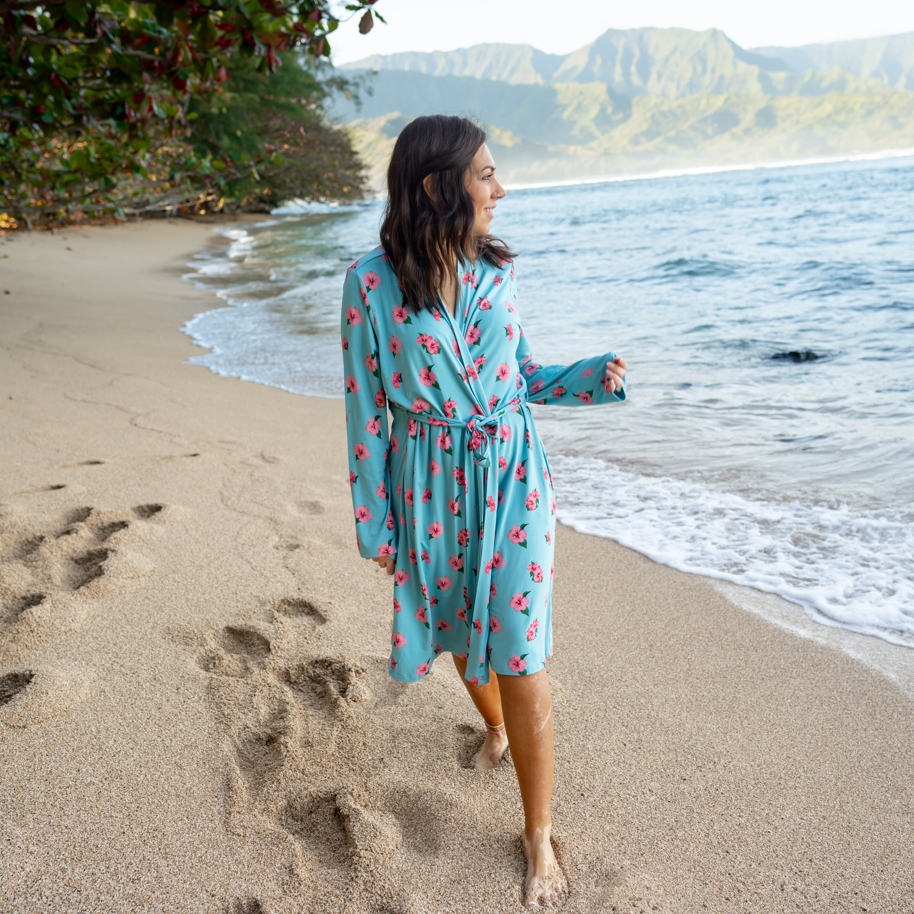 Woman wearing Women’s Lounge Robe in Hibiscus on the beach