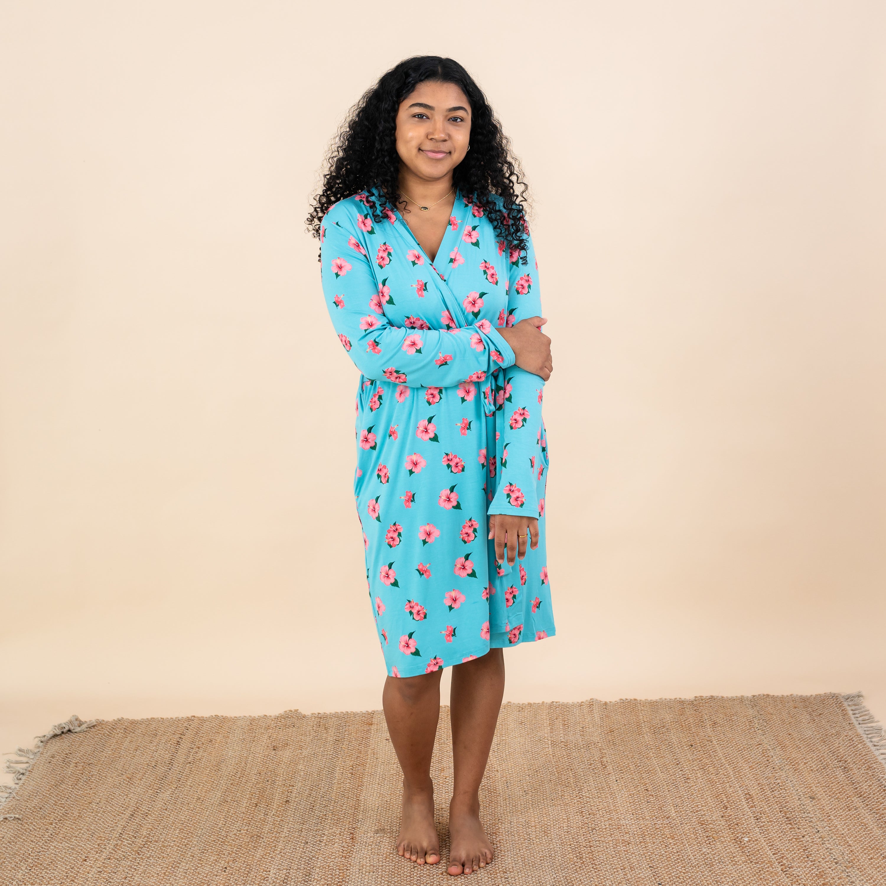 Woman wearing Kyte Women’s Lounge Robe in Hibiscus