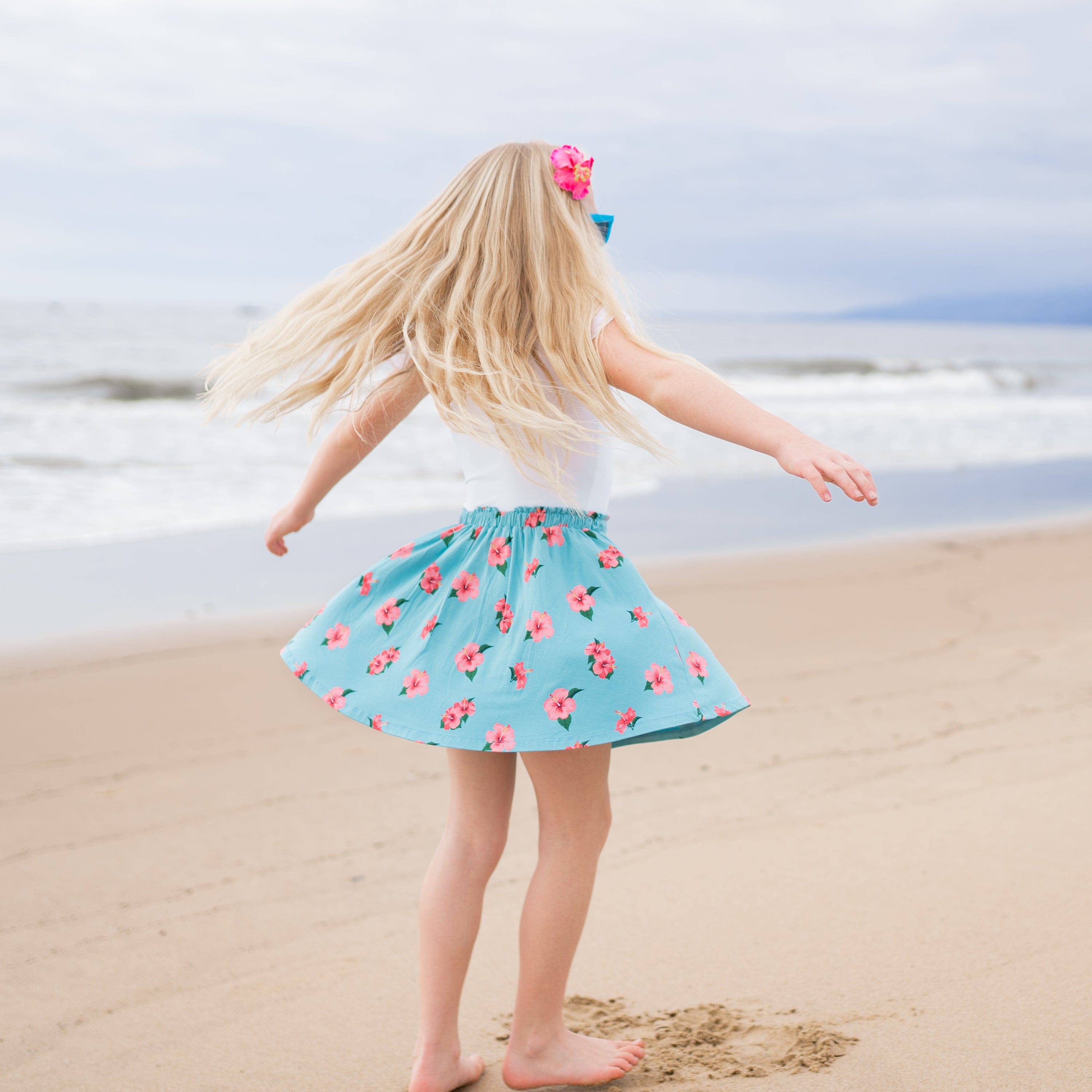 child twirling is skort in hibiscus