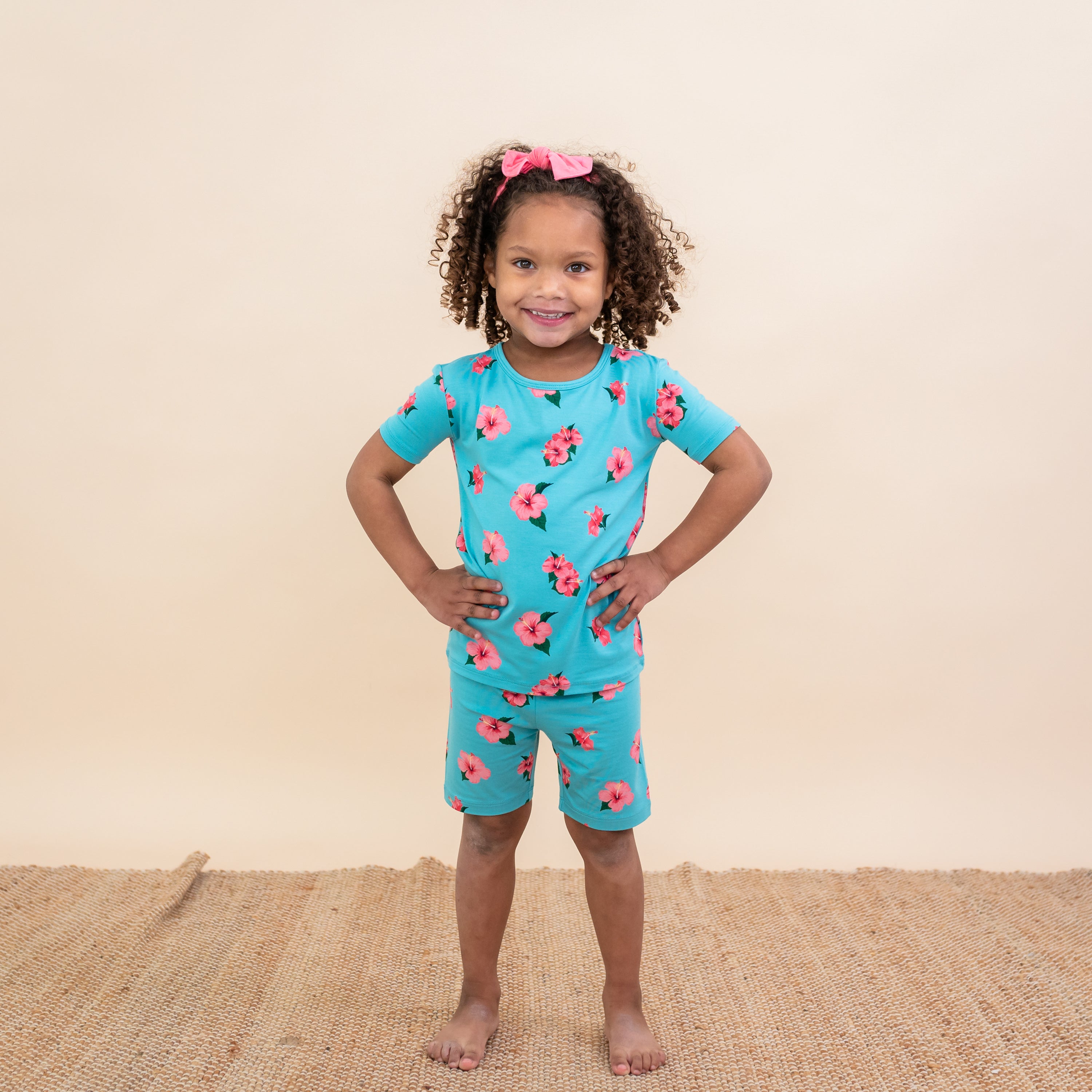 Toddler wearing Short Sleeve blue Pajamas in Hibiscus