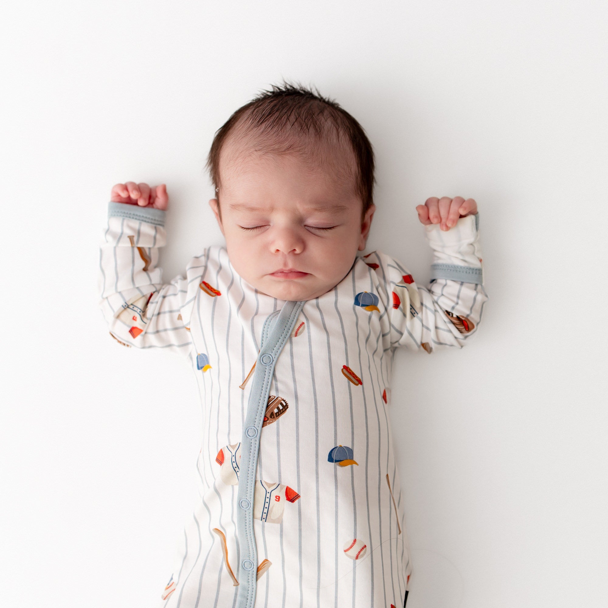 Close up of sleeping infant wearing the Bundler in Home Run