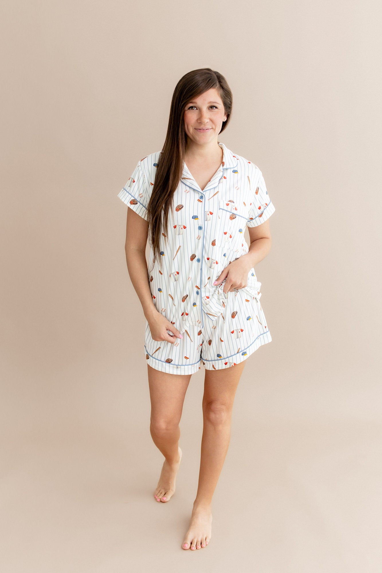Smiling female modeling the Women's Short Sleeve Pajama Set in Home Run