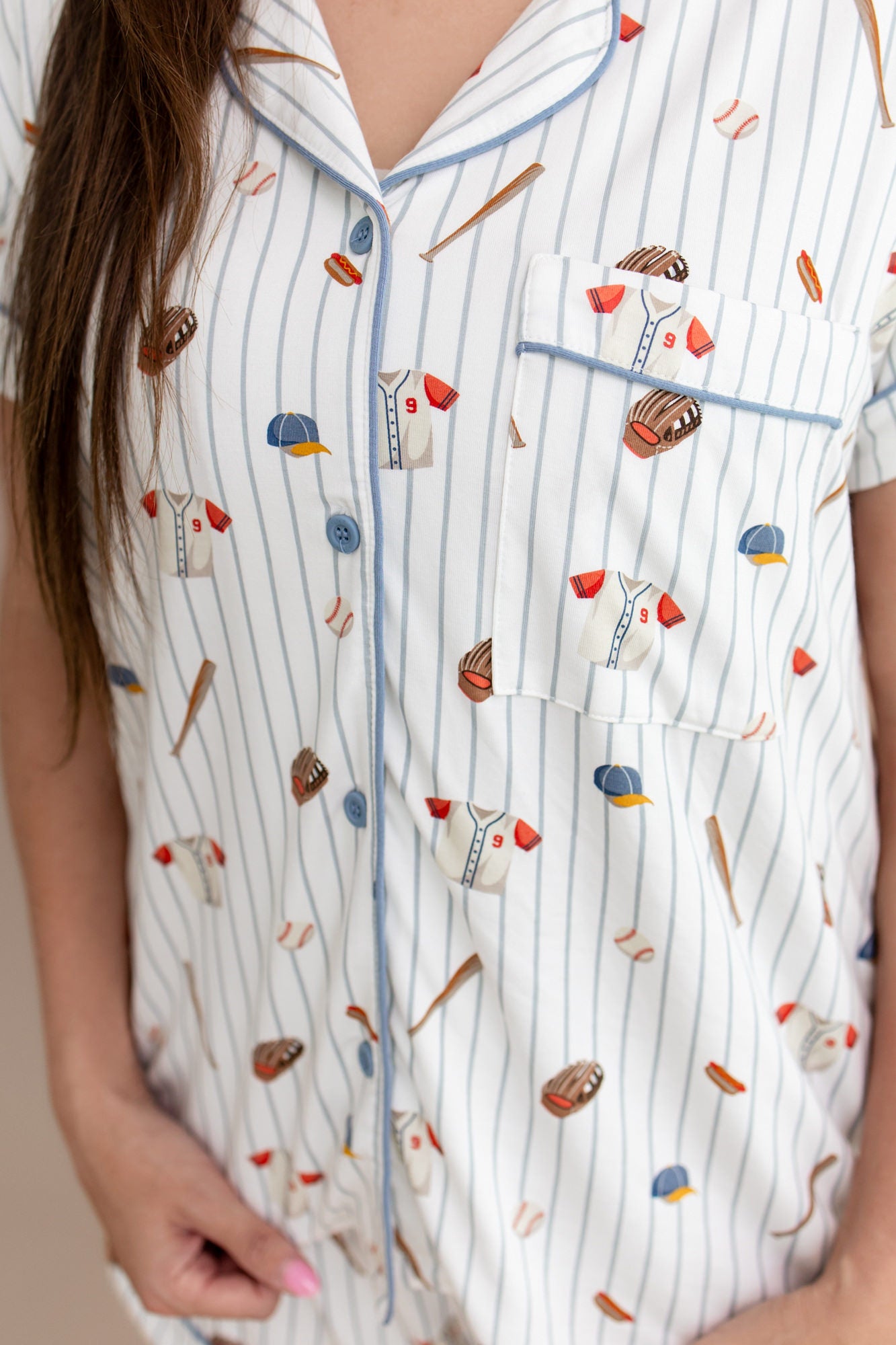 Close up of the chest pocket and slate colored trim shown on the shirt of the Women's Short Sleeve Pajama Set in Home Run