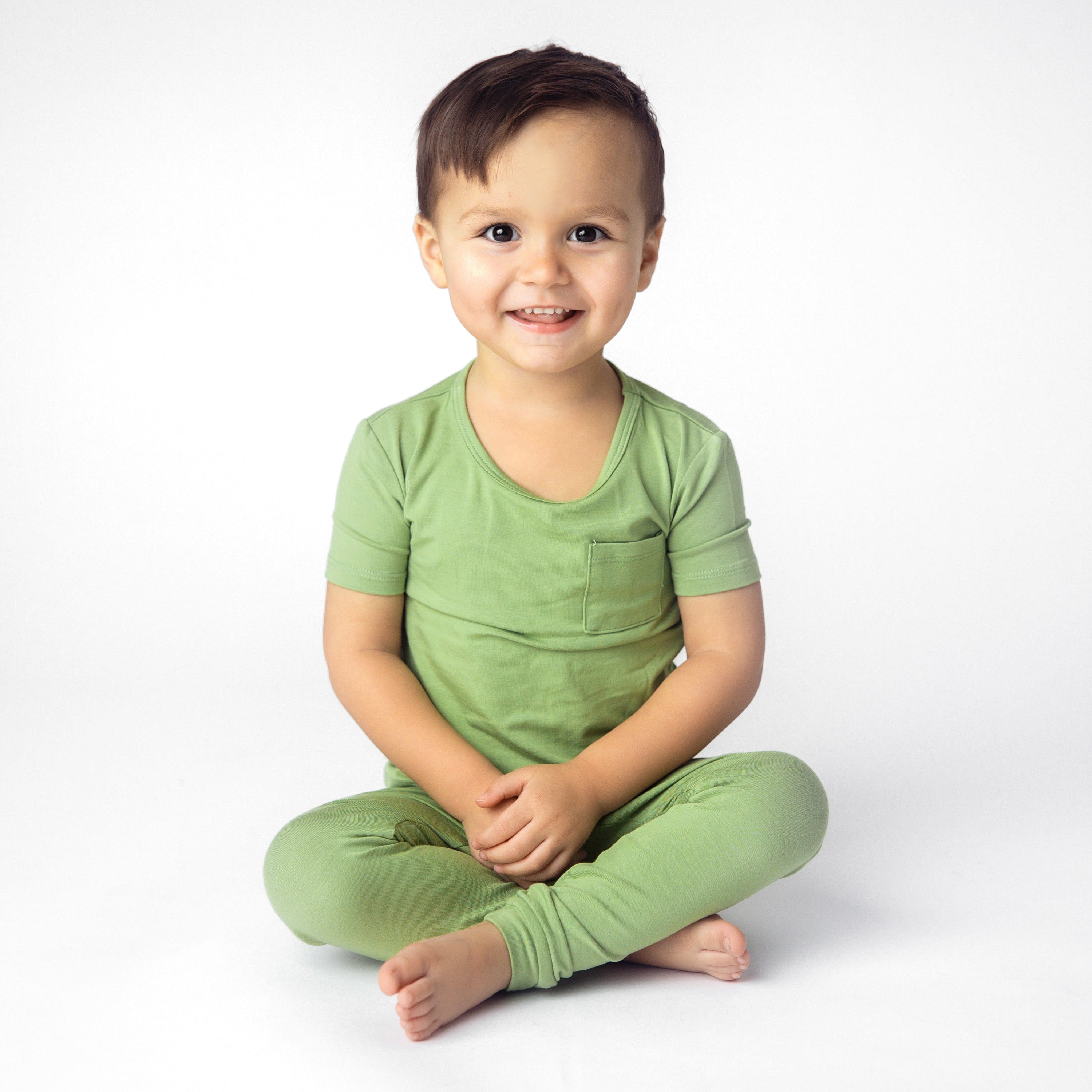 Boy wearing Short Sleeve with Pants Pajamas in Honu Green