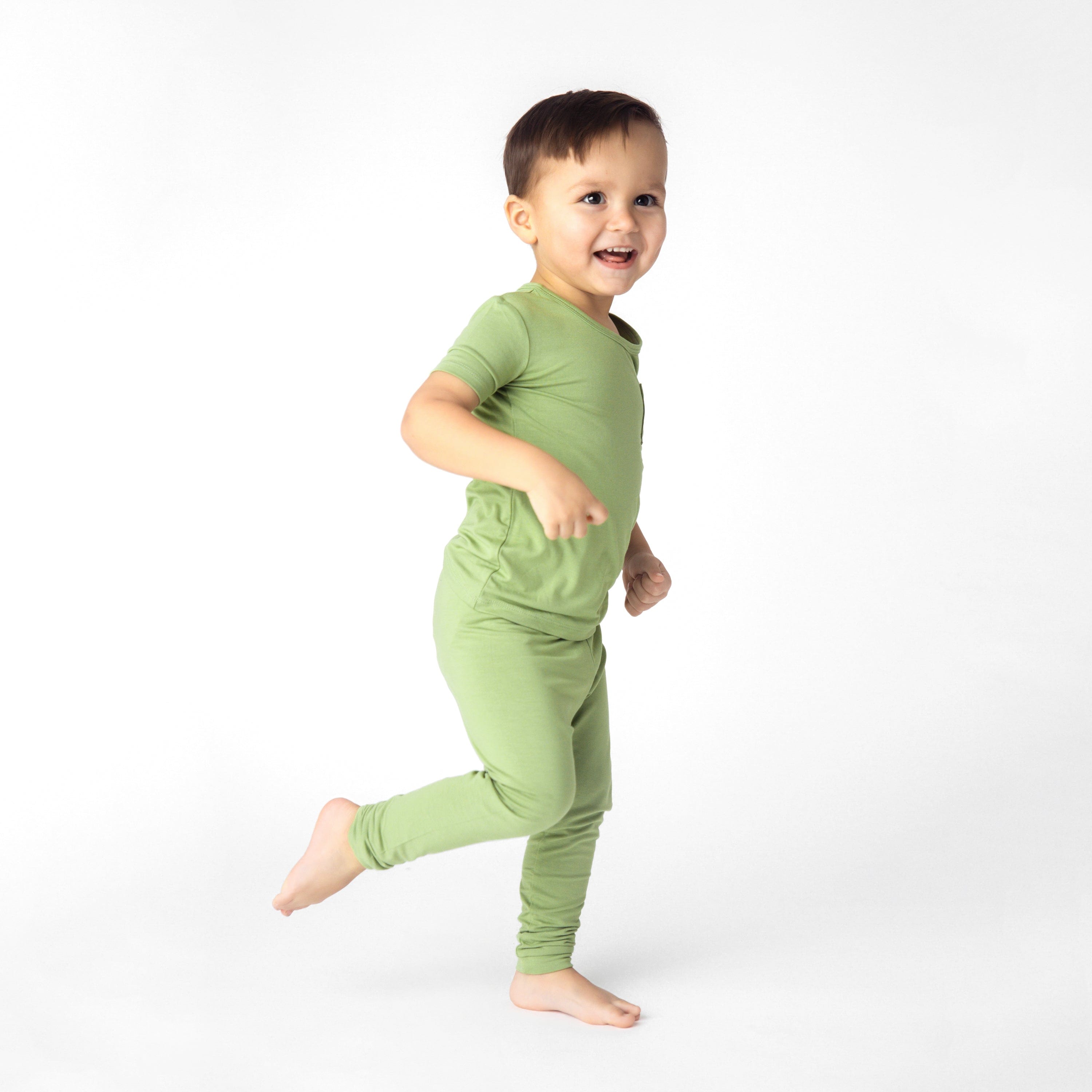 Toddler wearing short sleeve with pants pajamas in honu