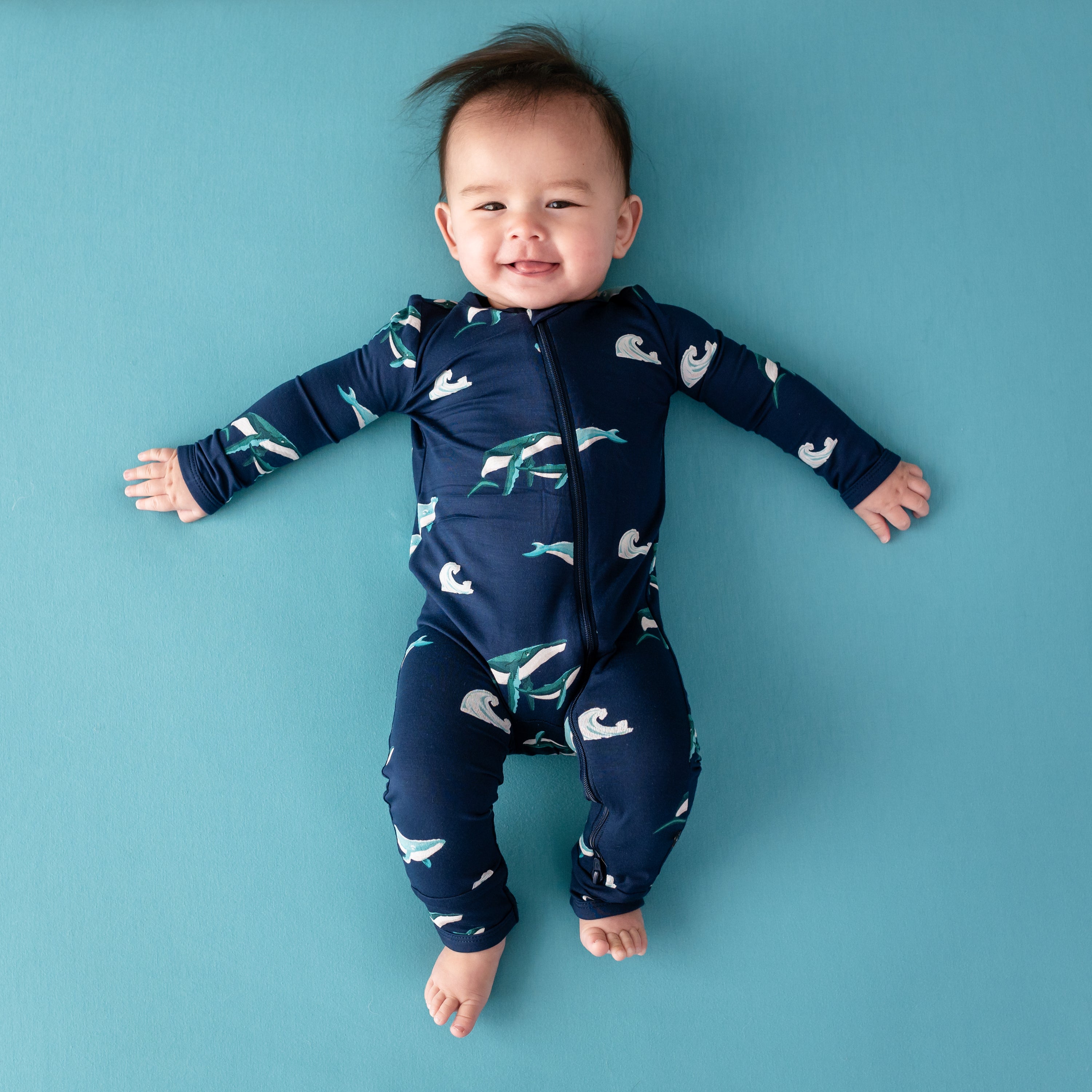 Infant wearing Kyte Baby Zippered Romper in Humpback