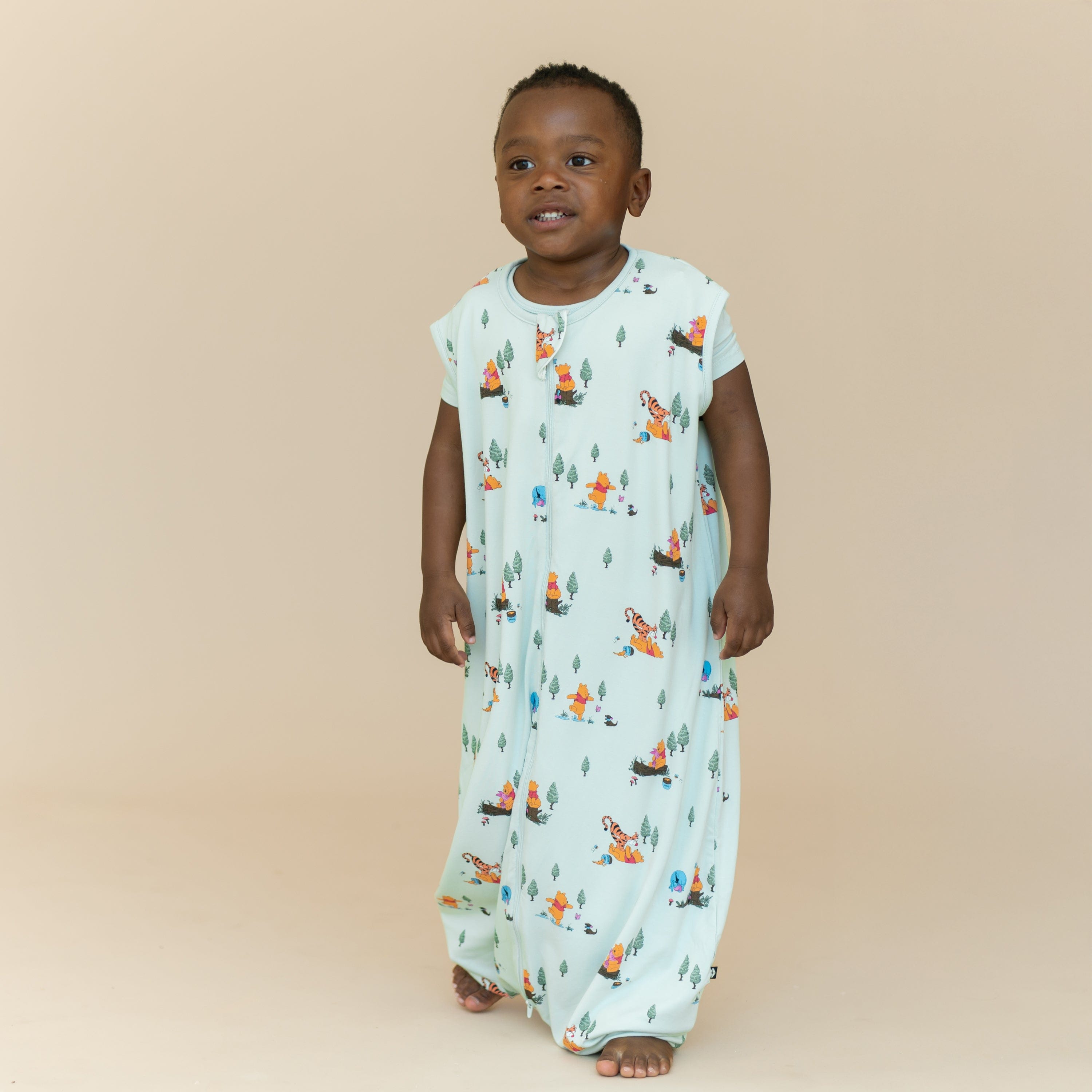 Young boy walking wearing the Sleep Bag Walker in Winnie the Pooh Hundred Acre Wood 1.0