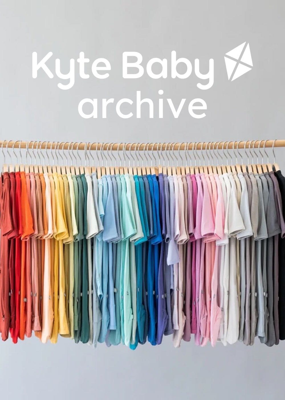 mobile version. kyte baby archive image showing clothing rack of footies in a rainbow of colors
