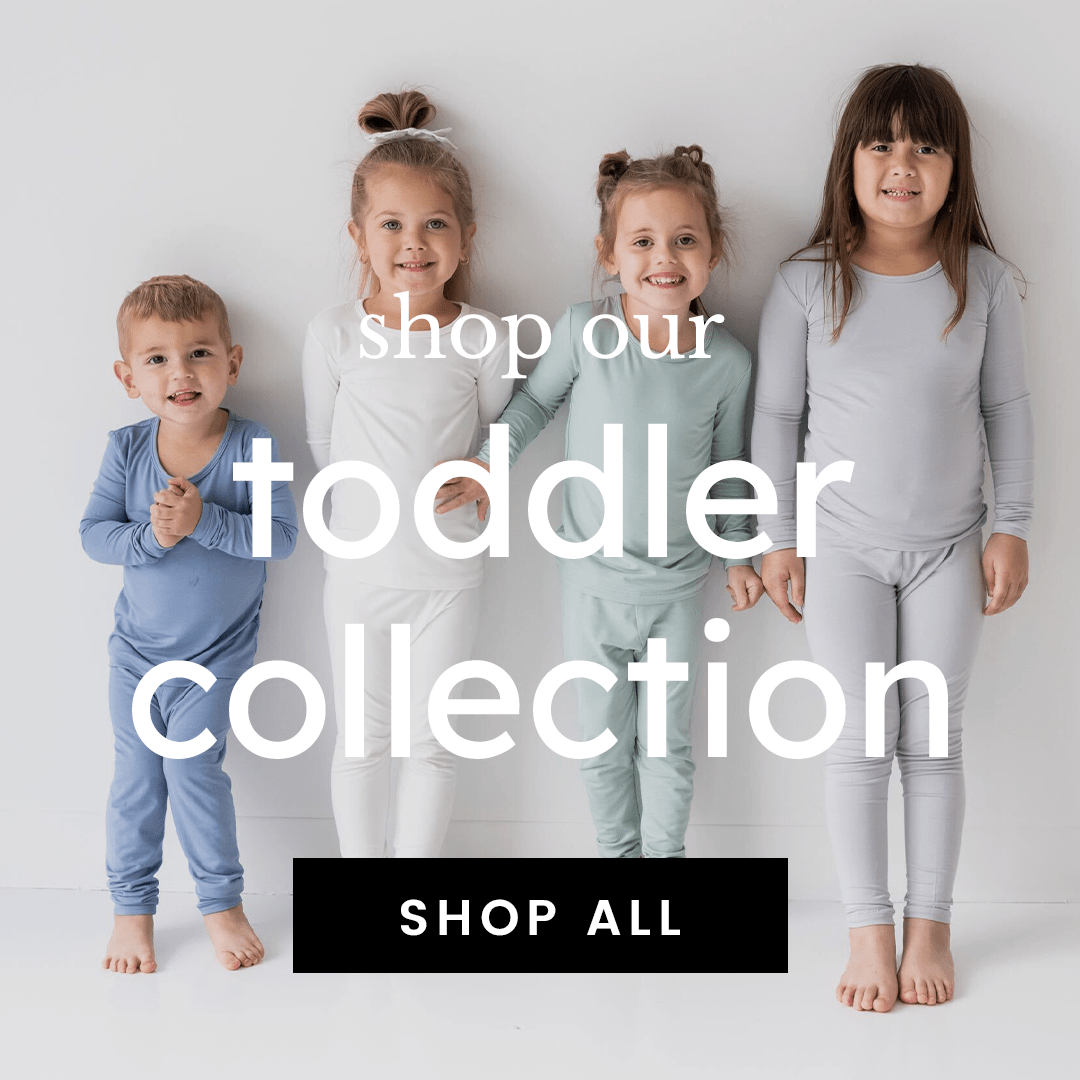Image of toddlers in pajamas with text that says shop our toddler collection. shop all