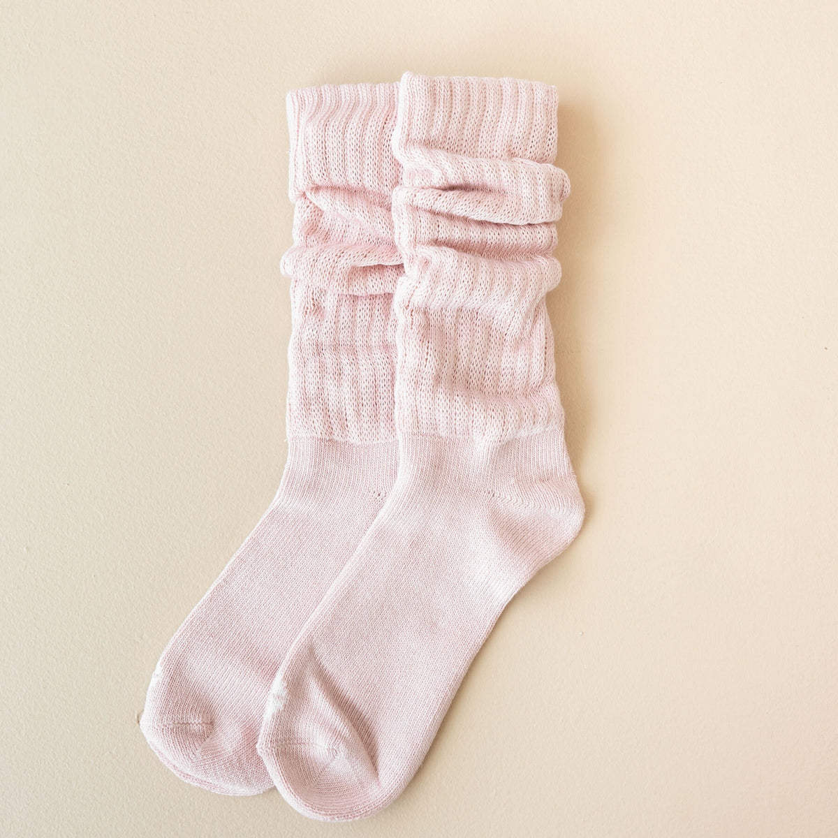 Product photo of the Adult Scrunch Socks in Blush shown scrunched on a light neutral background