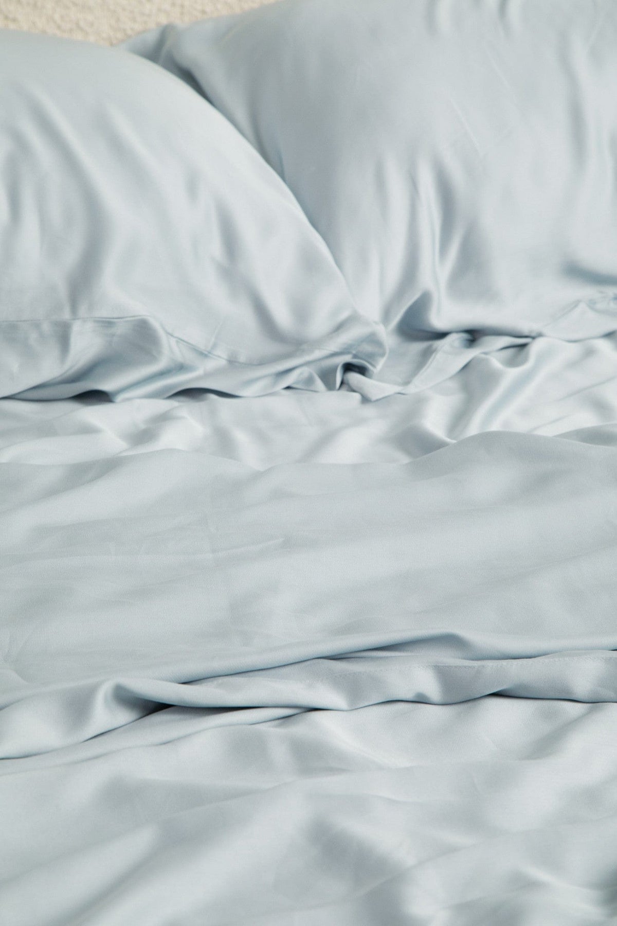 Close up of the Bamboo Sateen Sheet Set in Ice shown on a bed