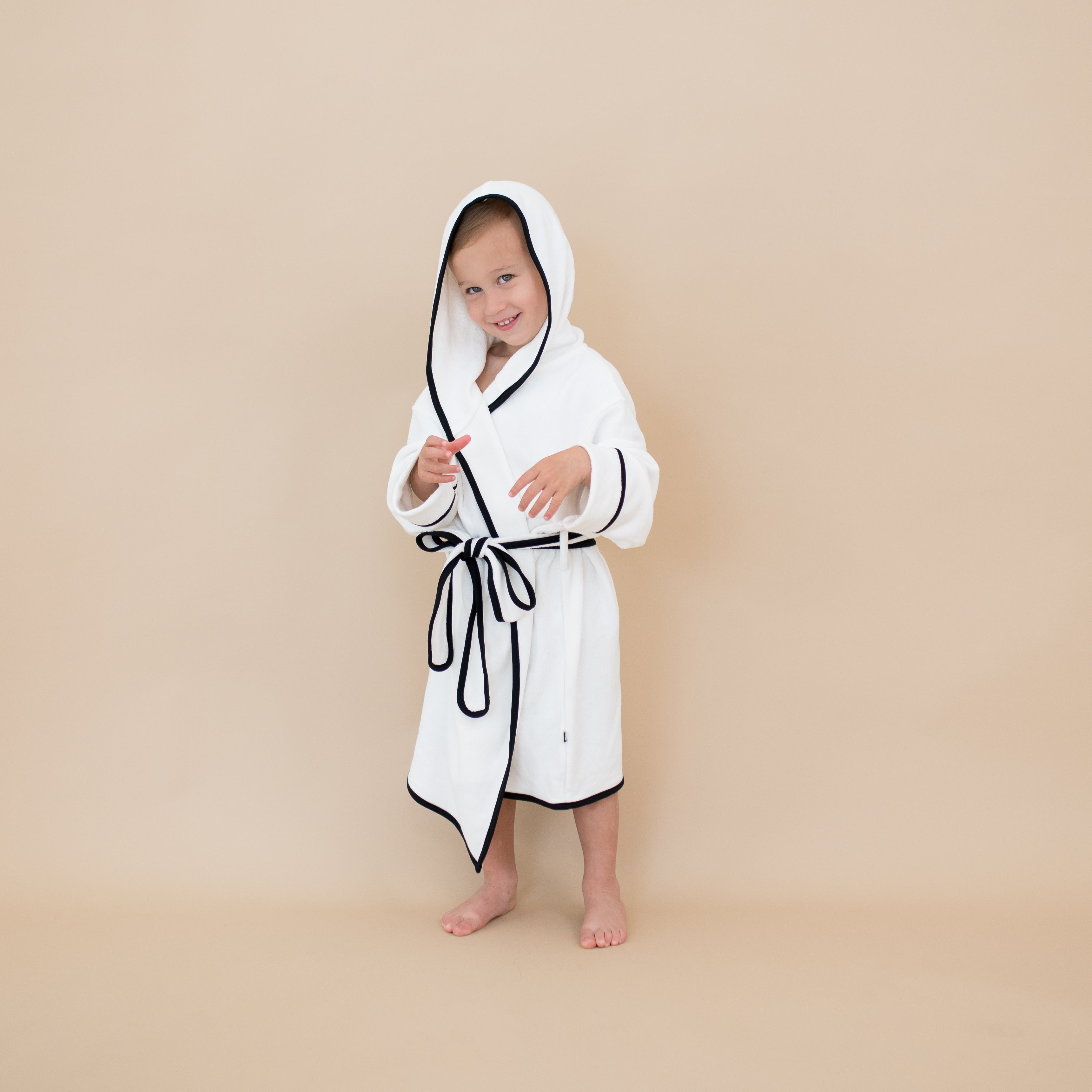 Child wearing Toddler Hooded Bath Robe in Cloud with Midnight Trim
