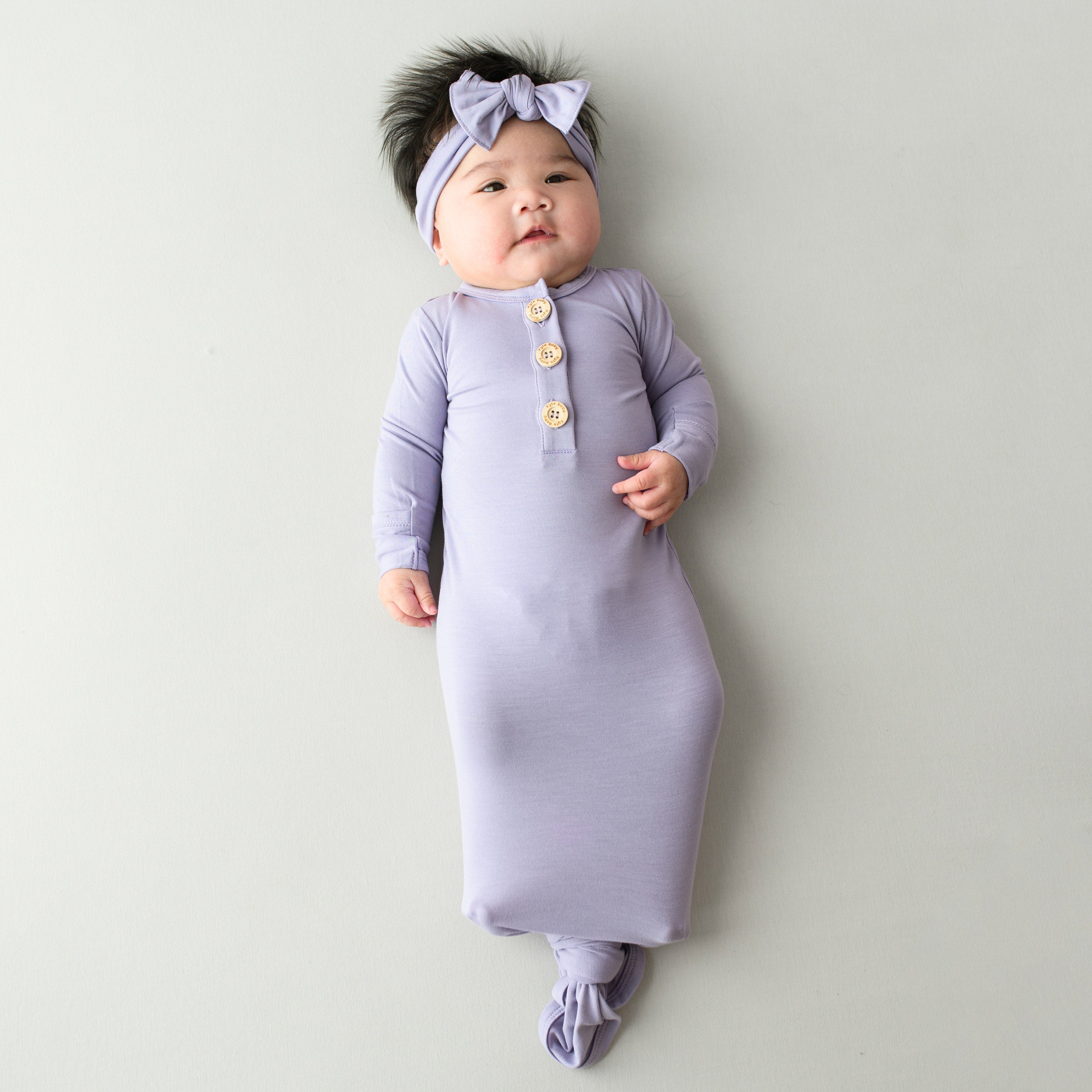 Newborn wearing Knotted Gown with Bow Set in Taro purple