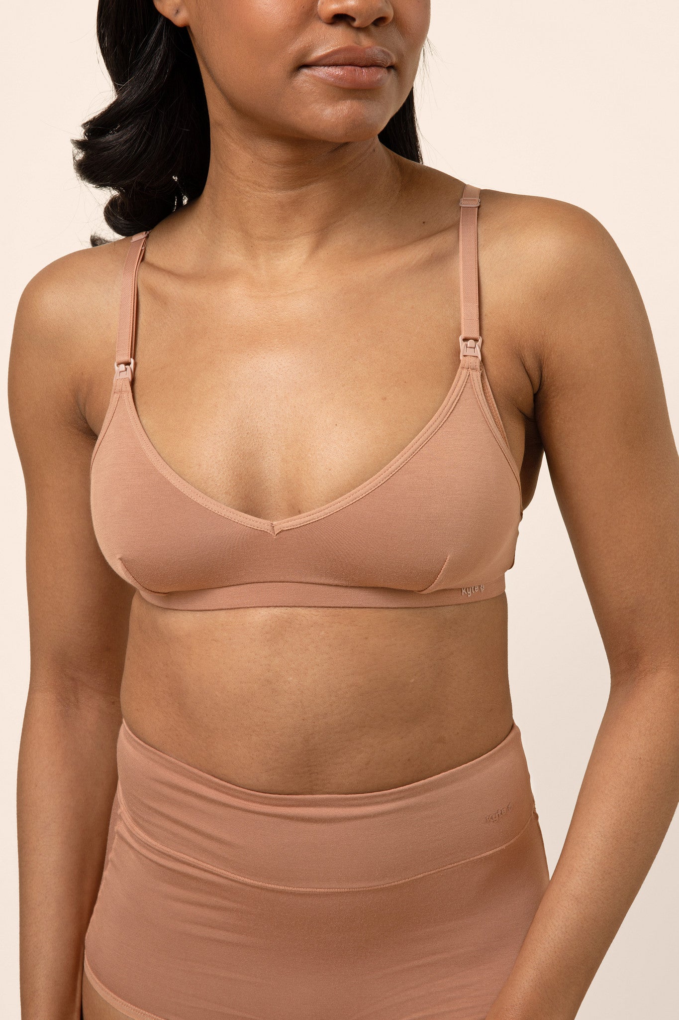 Female modeling the Women's Nursing Bra in Latte with matching underwear