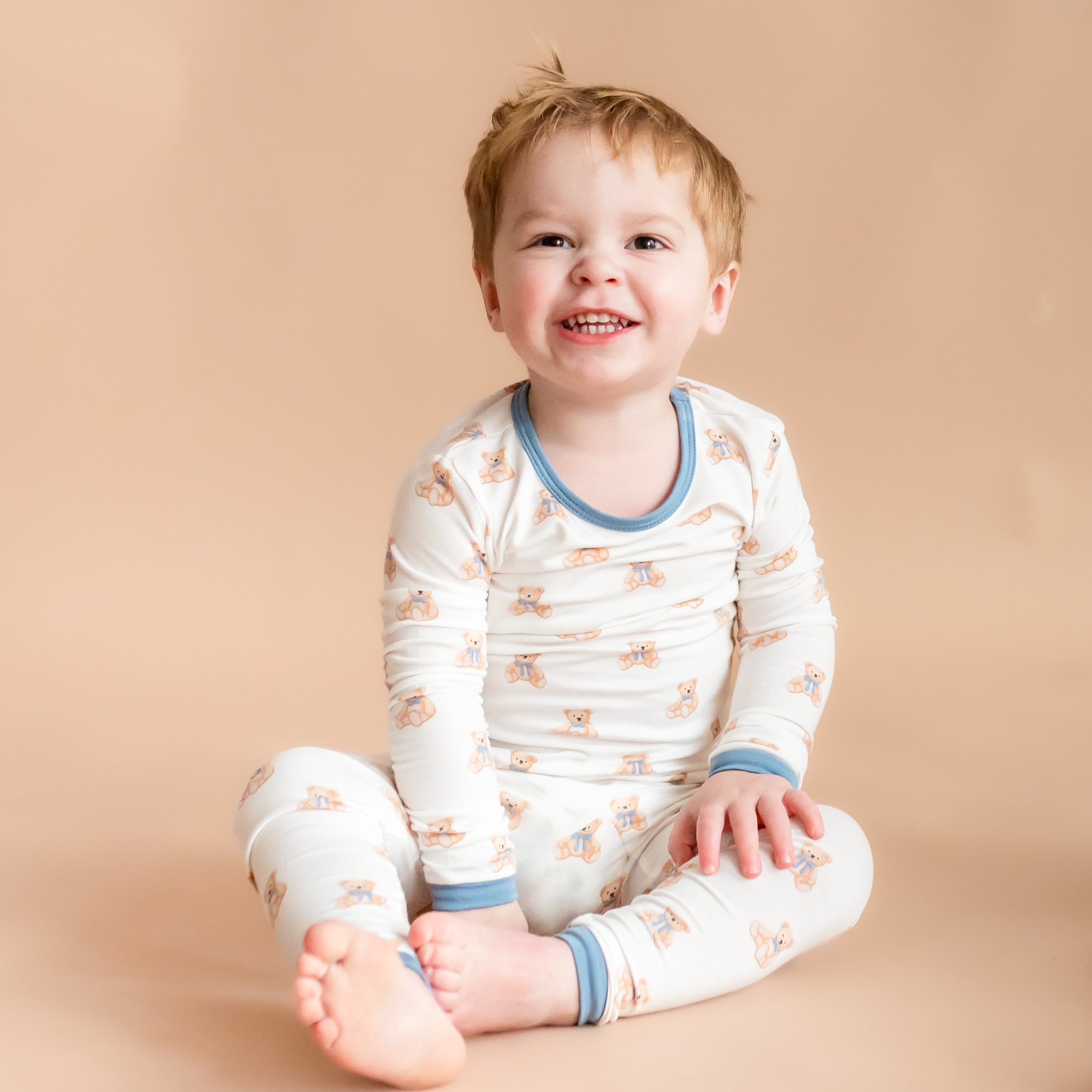 Boy wearing Long Sleeve Kids Pajamas in Teddy Bear print