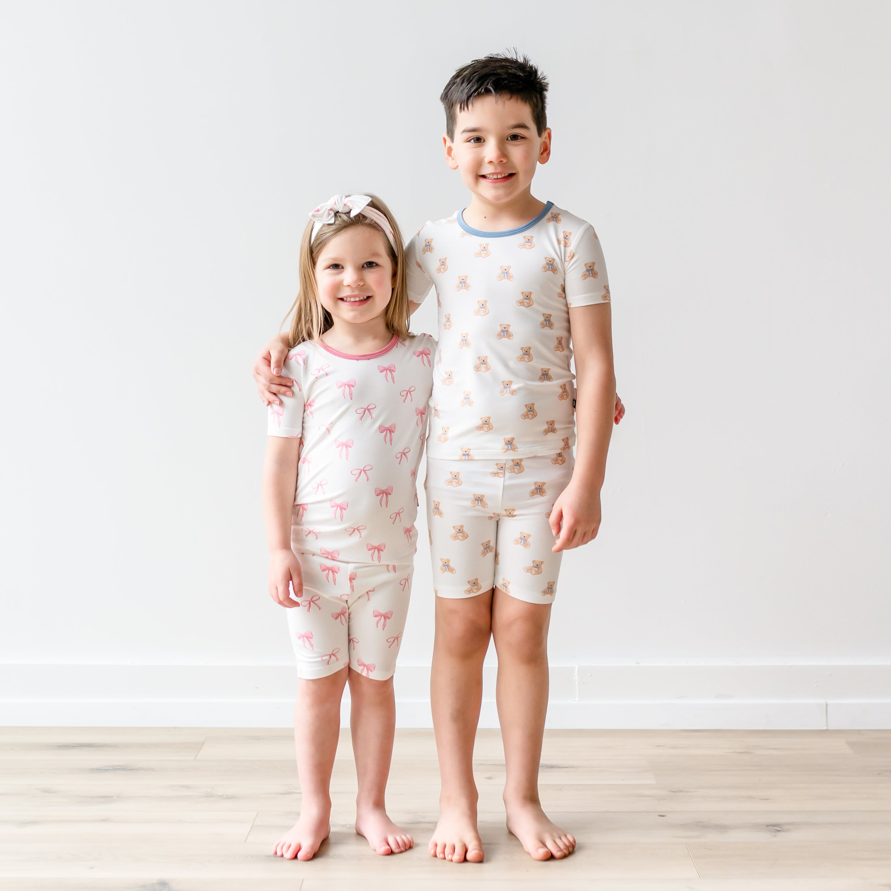 Kids wearing Short Sleeve Matching PJ Sets in Bow and Teddy Bear