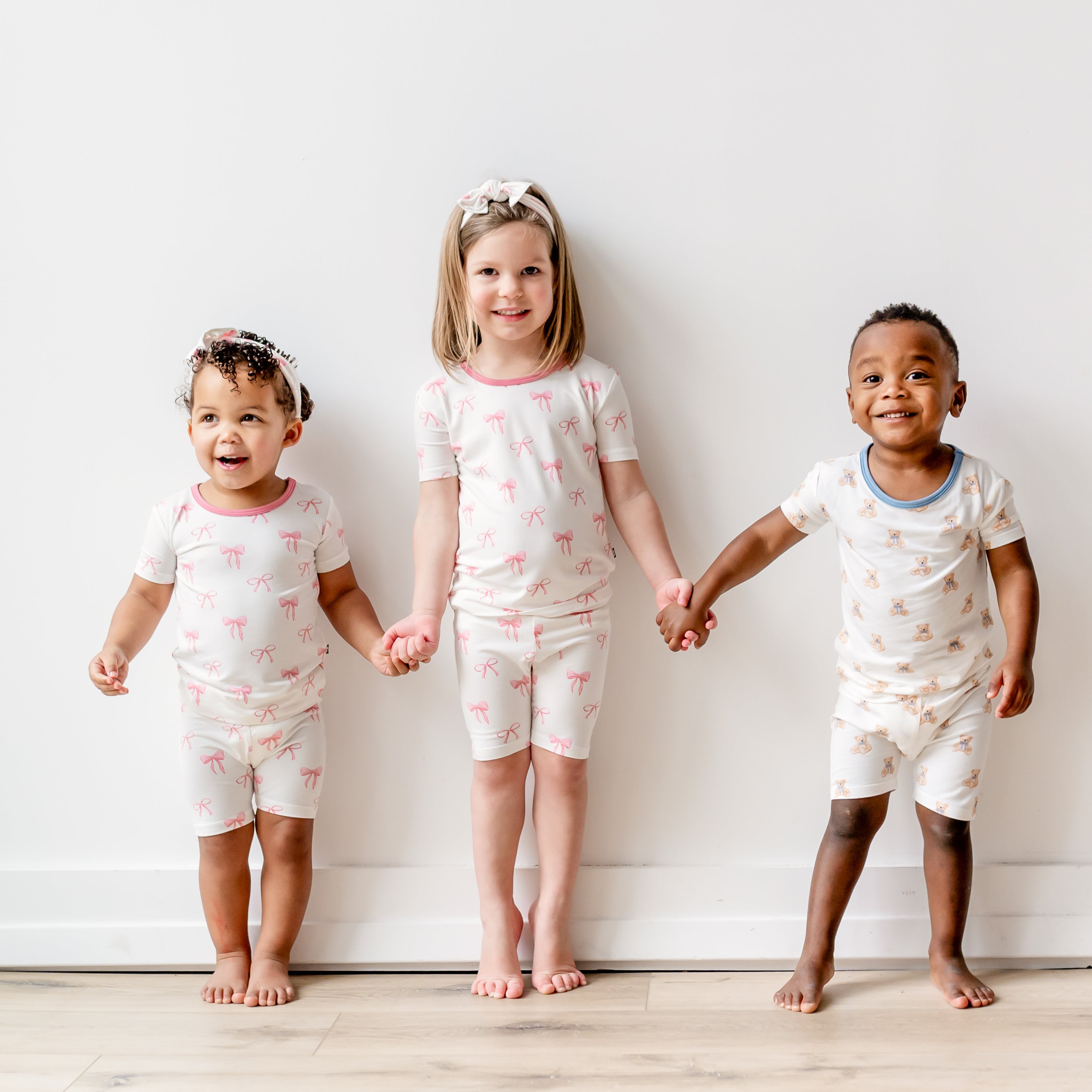 Children wearing Short Sleeve Kids Pajamas in Bow and Teddy Bear prints